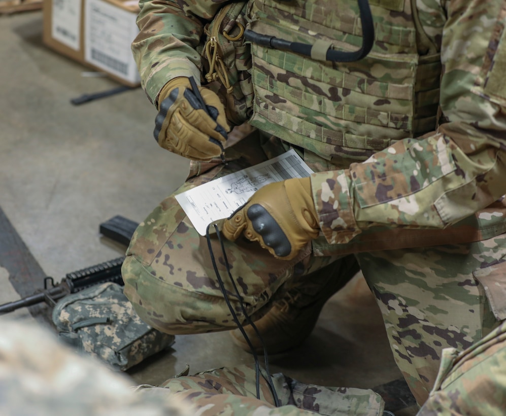 U.S. Army Reserve Soldier opens a liter during Combat Lifesaver Course