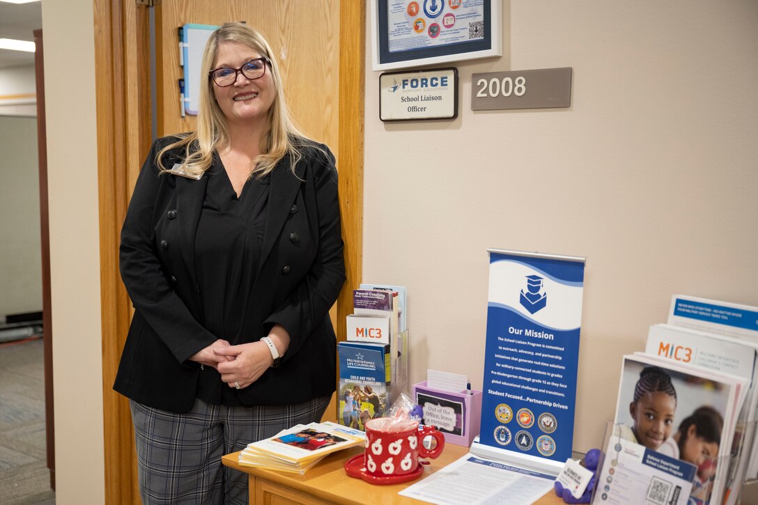 Jo Anne Mulholland, School Liaison Program Manager for Ellsworth Air Force Base, South Dakota, stands outside her office in the Rushmore Center on base Jan. 4, 2024.