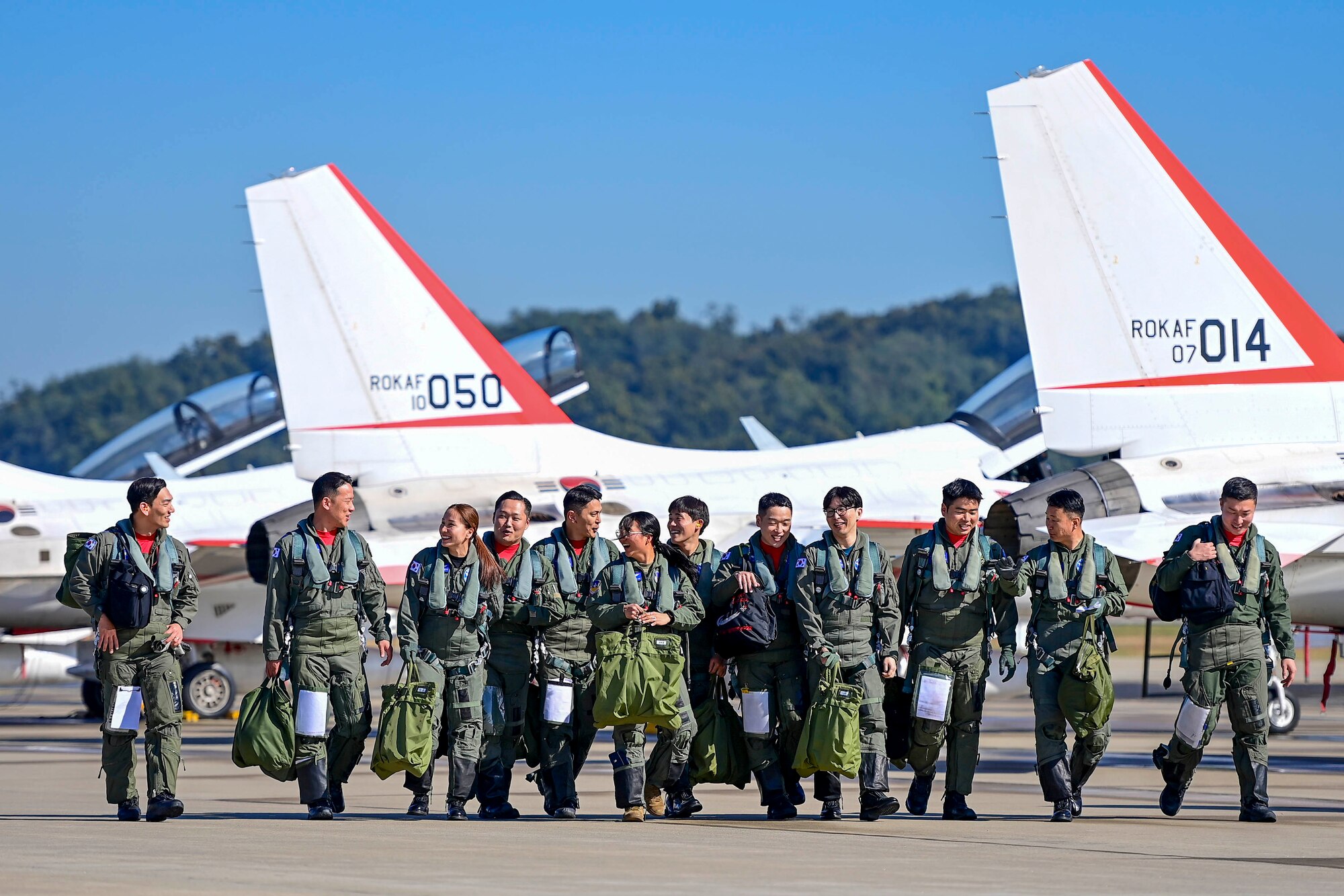 KT-50 instructor pilots and 2023 Honorary National Pilots walk the flight line following their incentive flights at Seoul Air Base, Republic of Korea, October 21, 2023.