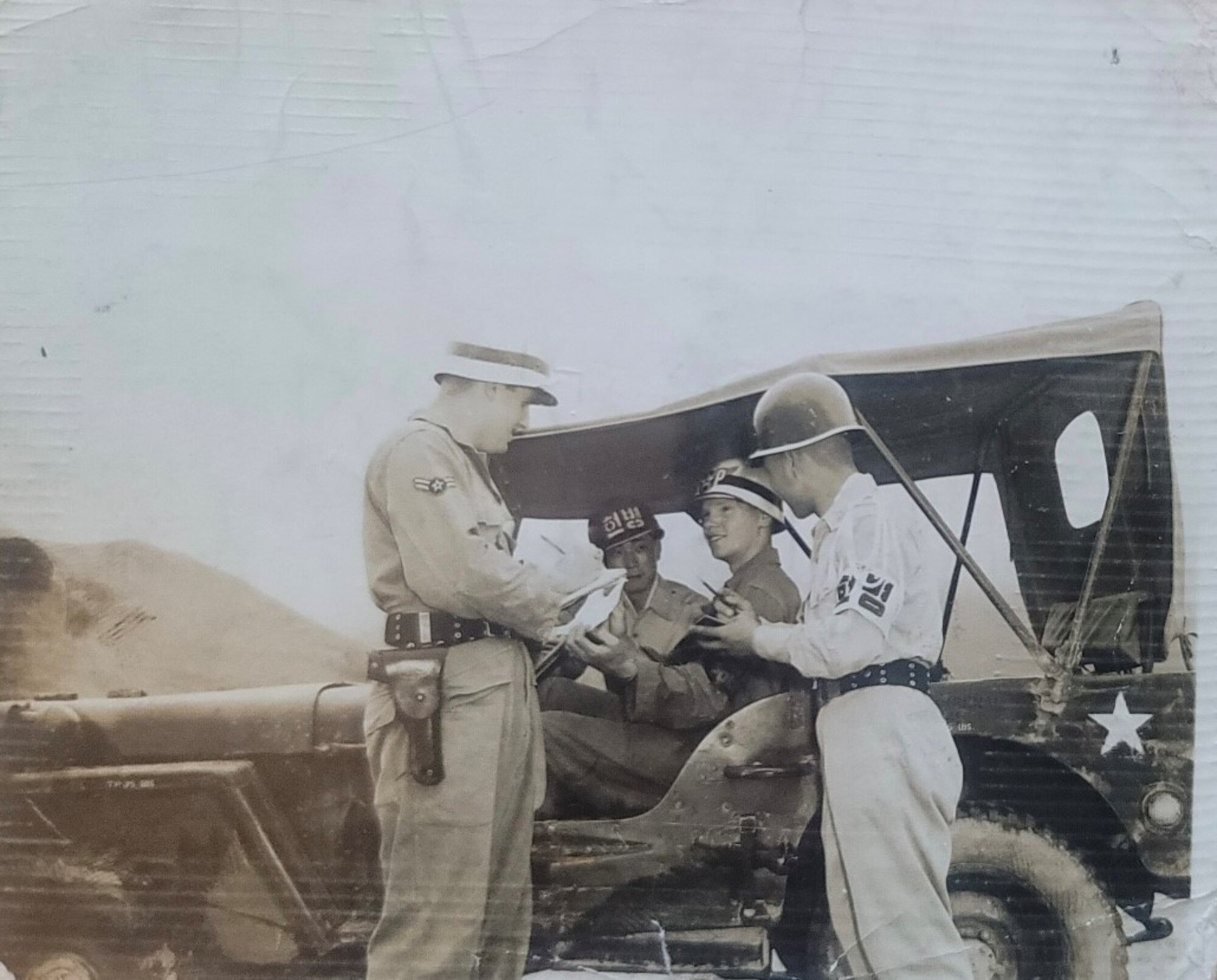 Republic of Korea Air Force and U.S. Air Force Military Police service members work together in South Korea some time after 1953, following the end of the Korean War.