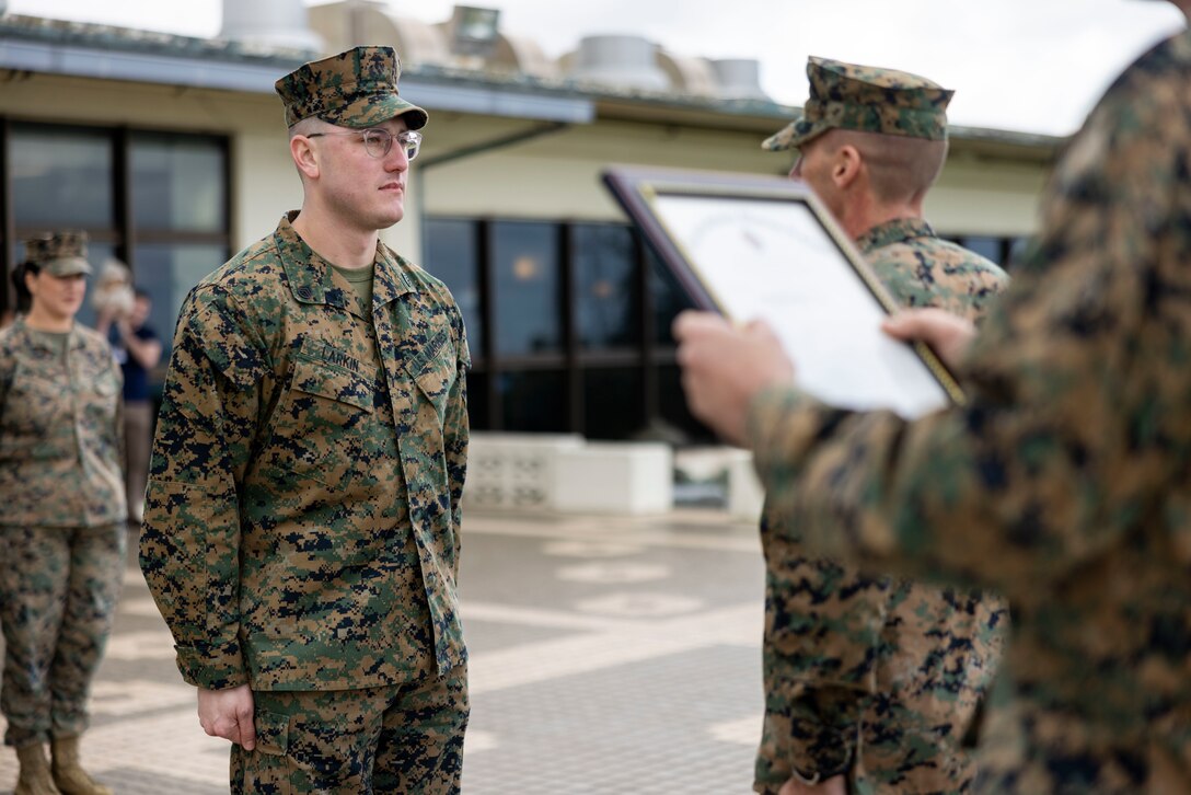 U.S. Marine Corps Staff Sgt. Craig Larkin, the Marine Aircraft Group 36 Headquarters career planner, meritoriously promotes to the rank of gunnery sergeant on Marine Corps Air Station (MCAS) Futenma, Okinawa, Japan, Dec. 22, 2023. Larkin promoted as the recipient of the 2023 Career Planner of the Year Award. (U.S. Marine Corps photo by Lance Cpl. Sav Ford)