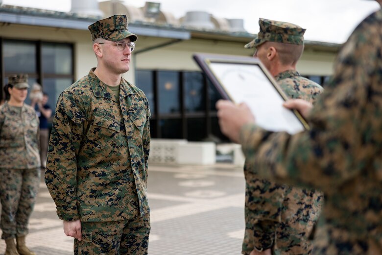 U.S. Marine Corps Staff Sgt. Craig Larkin, the Marine Aircraft Group 36 Headquarters career planner, meritoriously promotes to the rank of gunnery sergeant on Marine Corps Air Station (MCAS) Futenma, Okinawa, Japan, Dec. 22, 2023. Larkin promoted as the recipient of the 2023 Career Planner of the Year Award. (U.S. Marine Corps photo by Lance Cpl. Sav Ford)