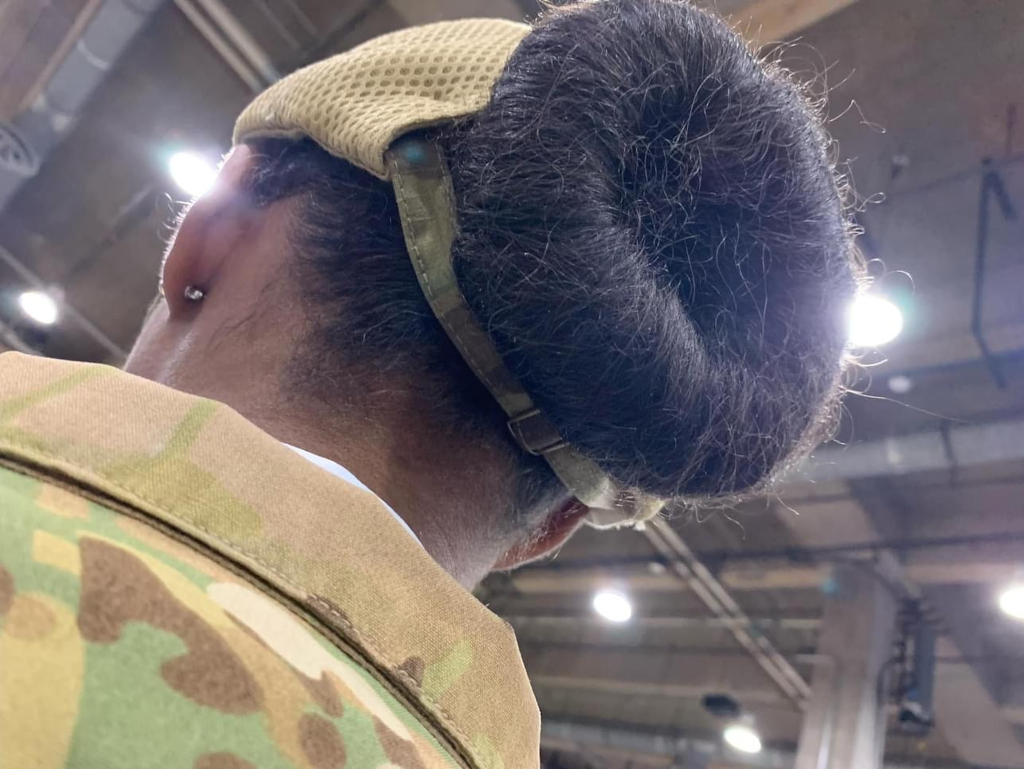 A member of the 436th Airlift Wing wears the newly designed unisex bump cap at the Airlift/Tanker Association Conference held in Grapevine, Texas Nov. 9, 2023. The new bump cap was created by U.S. Air Force Staff Sgt. Sheila Moody, 436th Aircraft Maintenance Squadron Air Force Repair Enhancement Program aircraft structural journeyman and U.S. Air Force Staff Sgt. Cortnee Madrid, 436th Aircraft Maintenance Squadron dock chief. (U.S. Air Force photo by Staff Sgt. Sheila Moody)
