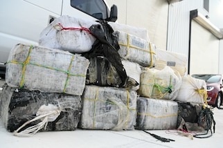 Bales of illicit narcotics are stacked during an offload from Coast Guard Cutter Margaret Norvell at Coast Guard Base Miami, Jan. 9, 2024.