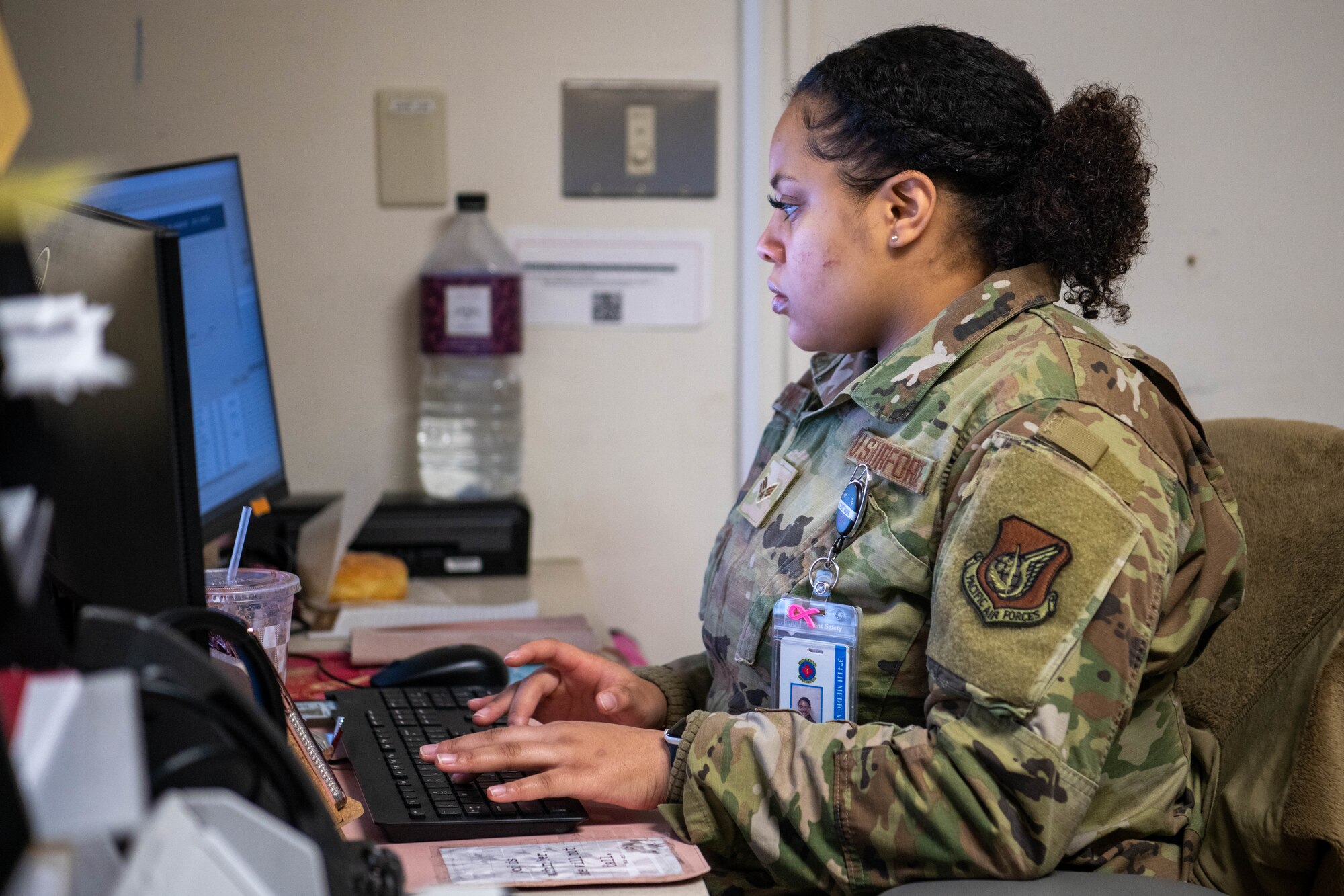 U.S. Air Force Senior Airman Shajaylah Smalls, 374th Operational Medical Readiness Squadron patient travel clerk, works the front desk.