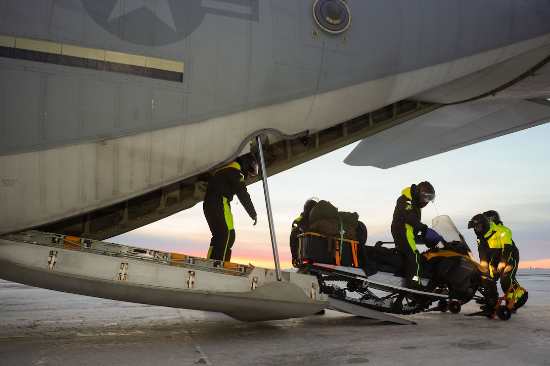 U.S. Marines with 4th Law Enforcement Battalion, Marine Forces Reserve, load snow machines onto a KC-130J Hercules assigned to Marine Aerial Refueler Transport Squadron (VMGR) 153, Marine Aircraft Group 24, 1st Marine Aircraft Wing to carry out the Toys for Tots mission in Kotzebue, Alaska, Dec. 13, 2023. VMGR-153 conducted combat assault transport and air delivery in support of Alaska Marines’ Toys for Tots mission which enhanced combat readiness and supported community relations in remote Alaskan villages. (U.S. Marine Corps photo by Staff Sgt. Olivia Ortiz)