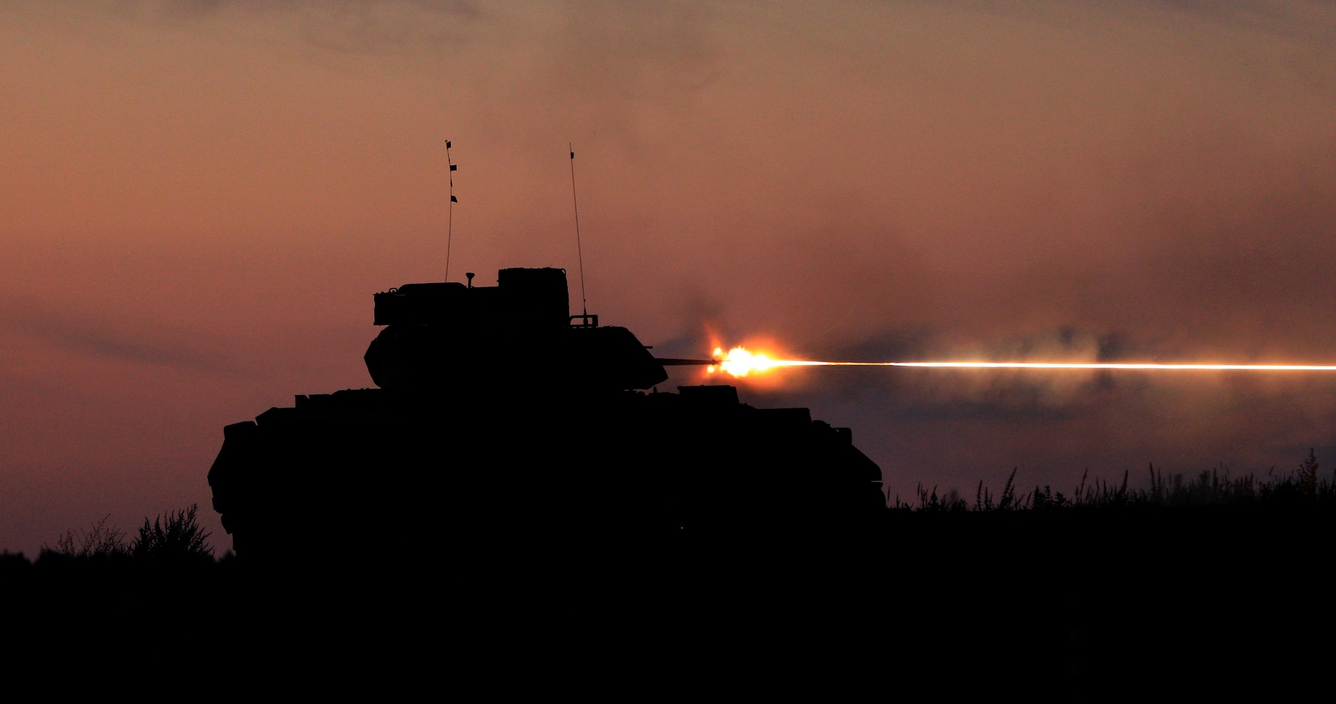 U.S. Army Soldiers with 1st Battalion, 8th Cavalry Regiment, 1st Cavalry Division, supporting 4th Infantry Division, conduct M2A3 Bradley fighting vehicle night live-fire qualification at Pabrade Training Area, Lithuania, Aug. 8. The 4th Inf. Div.'s mission in Europe is to engage in multinational training and exercises across the continent, working alongside NATO allies and regional security partners to provide combat-credible forces to V Corps, America’s forward deployed corps in Europe. (U.S. Army photo by Sgt. Cesar Salazar Jr.)