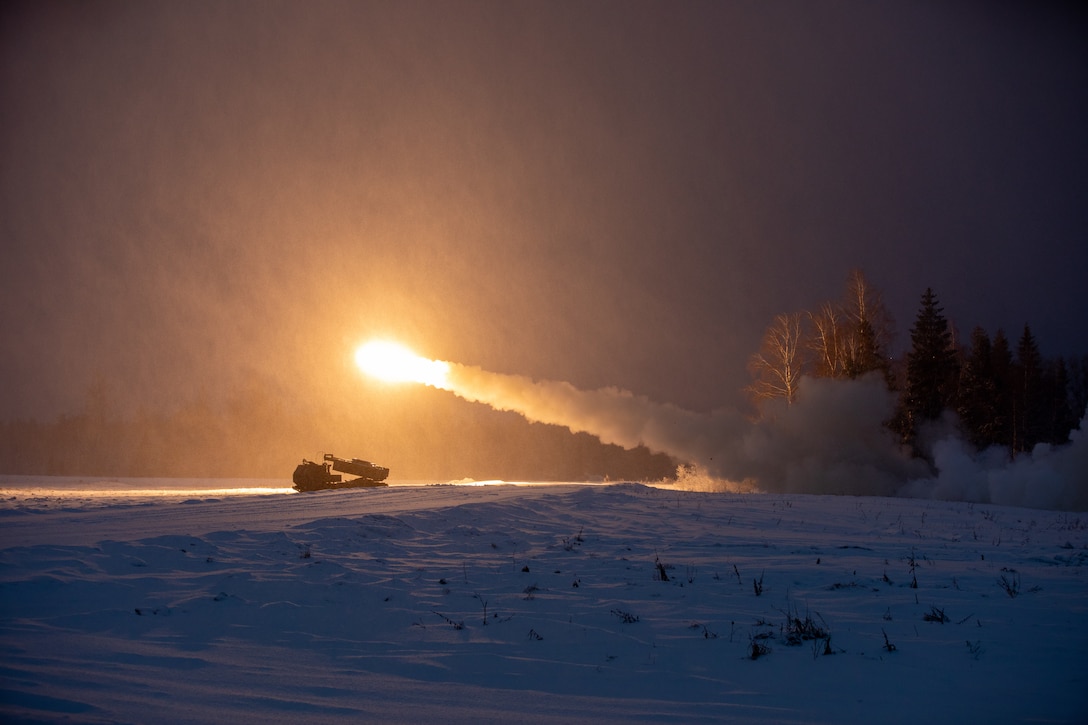 U.S. Army Soldiers assigned to Task Force Voit, 3rd Battalion, 27th Field Artillery Regiment, 18th Field Artillery Brigade, XVIII Airborne Corps, supporting 3rd Infantry Division, demonstrate the M142 High-Mobility Artillery Rocket System (HIMARS) to multinational troops from NATO’s enhanced Forward Presence Battle Group Estonia during a live-fire exercise at the Central Training Area​​ near Camp Tapa, Estonia, Dec. 22, 2023. The 3rd Infantry Division’s mission in Europe is to engage in multinational training and exercises across the continent, working alongside NATO Allies and regional security partners to provide combat-credible forces to V Corps, America’s forward deployed corps in Europe. (U.S. Army photo by Capt. H Howey)