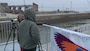 Visitors to Lock and Dam 13 in Fulton, Illinois, looking for eagles from the observation deck during an annual Bald Eagle Watch event.