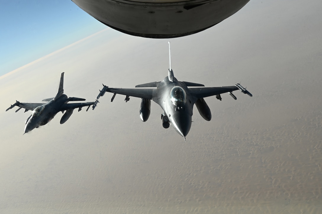 A U.S. Air Force F-16 Fighting Falcons fly in sync after an aerial refueling over an undisclosed location within the U.S. Central Command area of responsibility during Ballast Cannon, Jan. 7, 2024. As a routine exercise occurring nearly quarterly with the Royal Bahraini Air Force, this iteration supports the U.S. Air Force’s rapid expeditionary capabilities by integrating Agile Combat Employment objectives for F-16 Fighting Falcon, KC-135 Stratotanker, and operational support personnel.  (U.S. Air Force photo by Staff Sgt. Jasmonet Holmes)