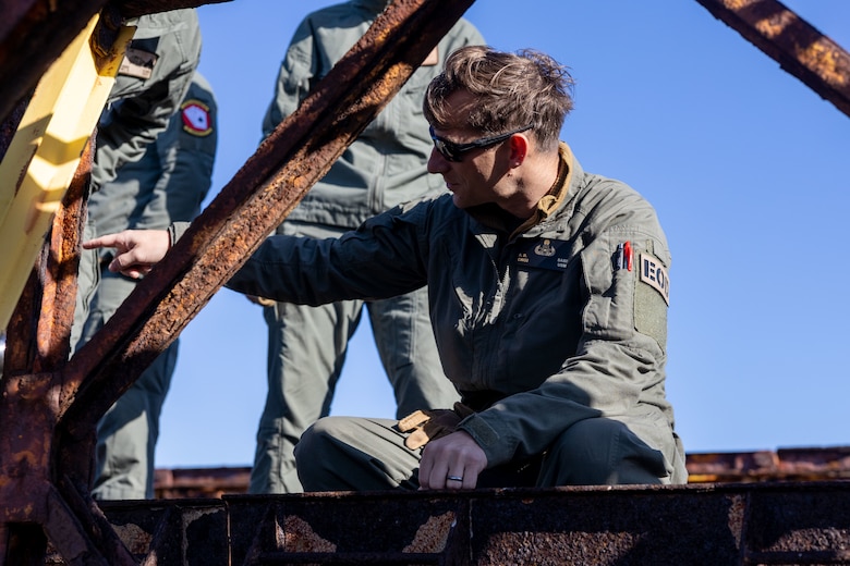U.S. Marine Corps Chief Warrant Officer 2 Austin Sabin, an explosive ordnance disposal officer with Marine Wing Support Squadron (MWSS) 373, Marine Air Control Group 38, 3rd Marine Aircraft Wing, inspects damage and deterioration on the Bailey Bridge during a bridge demolition operation as part of phase I of Strategic Mobility Exercise (STRATMOBEX) II at San Clemente Island, California, Jan. 4, 2024. During phase I, MWSS-373 demolished a hazardous bridge that hindered range control’s ability to insert targets into the Shore Bombardment Area of San Clemente Island. Phase I set conditions for phases II and III of STRATMOBEX II, the construct of a shallow water crossing and follow on missions. (U.S. Marine Corps photo by Sgt. Luc Boatman)