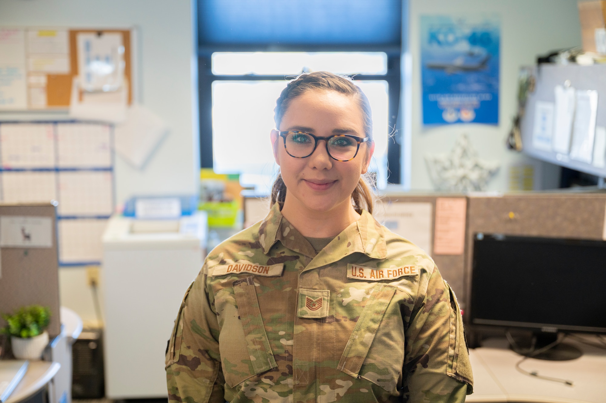 Airman stands in public health office.