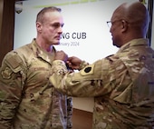 Maj. Gen. Rodney Boyd, the Assistant Adjutant General - Army for the Illinois National Guard and the Commander of the Illinois Army National Guard, presents Air Force Col. Shawn Strahle, the Deputy Commander of the Illinois Air National Guard's 183rd Wing, with the Meritorious Service Medal for more than four years of service as the Director of Information Management, part of the Illinois Army National Guard's staff.