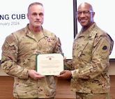 Maj. Gen. Rodney Boyd, the Assistant Adjutant General - Army for the Illinois National Guard and the Commander of the Illinois Army National Guard, presents Air Force Col. Shawn Strahle, the Deputy Commander of the Illinois Air National Guard's 183rd Wing, with the Meritorious Service Medal for more than four years of service as the Director of Information Management, part of the Illinois Army National Guard's staff.