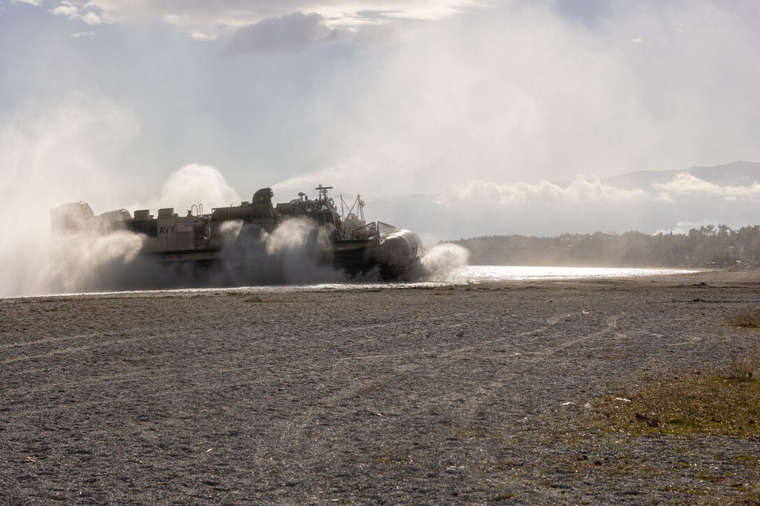 A landing craft air-cushioned, assigned to San Antonio-class amphibious transport dock USS Mesa Verde (LPD 19), comes ashore during the 26th MEU(SOC) Exercise “Odyssey Encore”, Volos, Greece, Jan. 8, 2024. The 26th Marine Expeditionary Unit (Special Operations Capable) Marine Air-Ground Task Force readiness sustainment exercise enhances the unit’s operational capabilities as a crisis response force. The Bataan Amphibious Ready Group, with the embarked 26th Marine Expeditionary Unit (Special Operations Capable), is on a scheduled deployment in the U.S. Naval Forces Europe area of operations, employed by U.S. Sixth Fleet to defend U.S., Allied and partner interests. (U.S. Marine Corps photo by Sgt. Matthew Romonoyske-Bean)