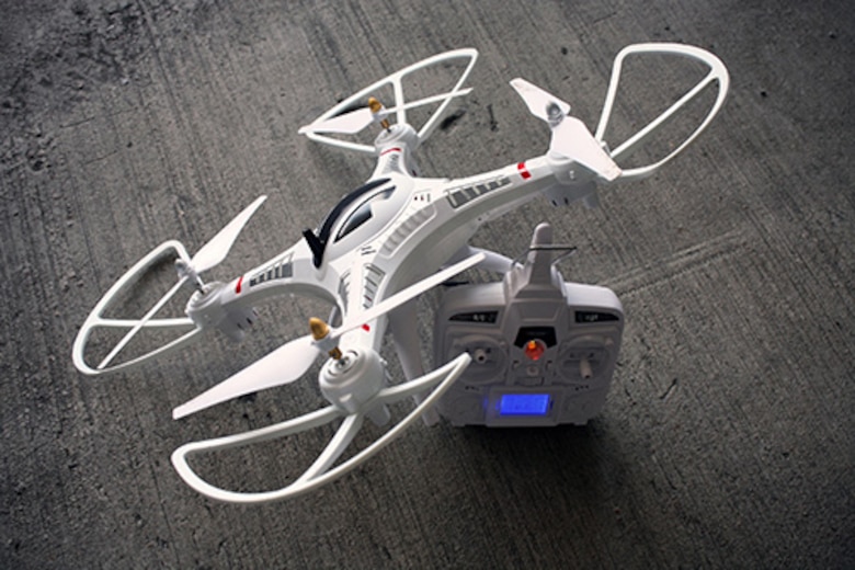 Drone with remote sitting on a floor