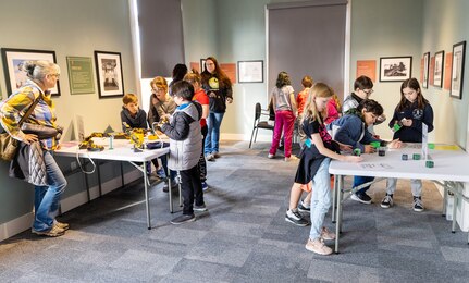 Local fourth- and fifth-grade students from Silver Ridge Elementary School, participate in activities which help them learn the difference between high-tech machines and robots, during STEM Days activities Nov. 15, 2023, at the Puget Sound Navy Museum, in Bremerton Washington. (U.S Navy Photo by Wendy Hallmark)