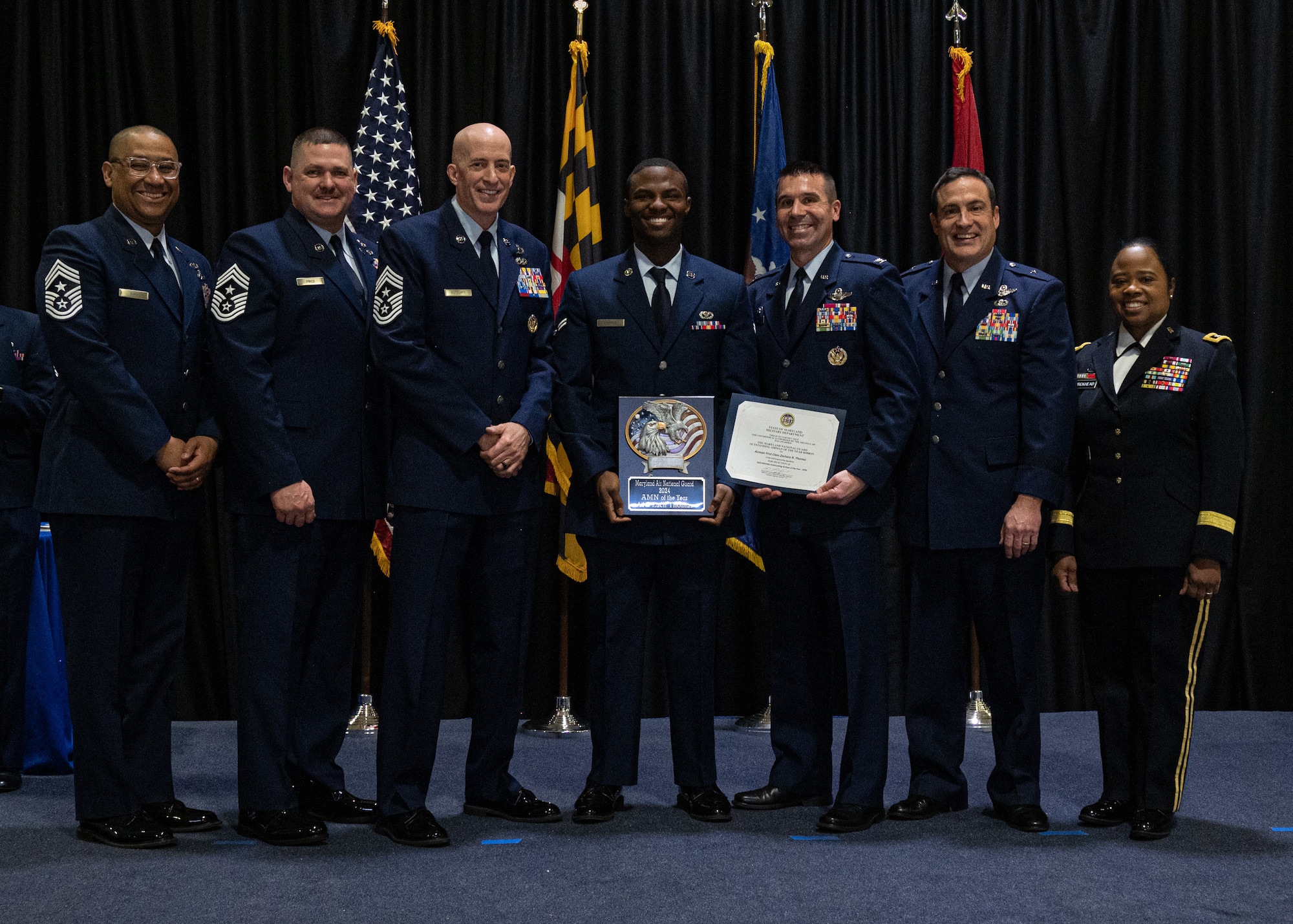 Maryland Air National Guard Airman First Class Zachary Thomas, 175th Wing Outstanding Airman of the Year for the airman category, Maryland Air National Guard, receives a plaque at Martin State Air National Guard Base, Middle River, Maryland, Jan. 7, 2024.