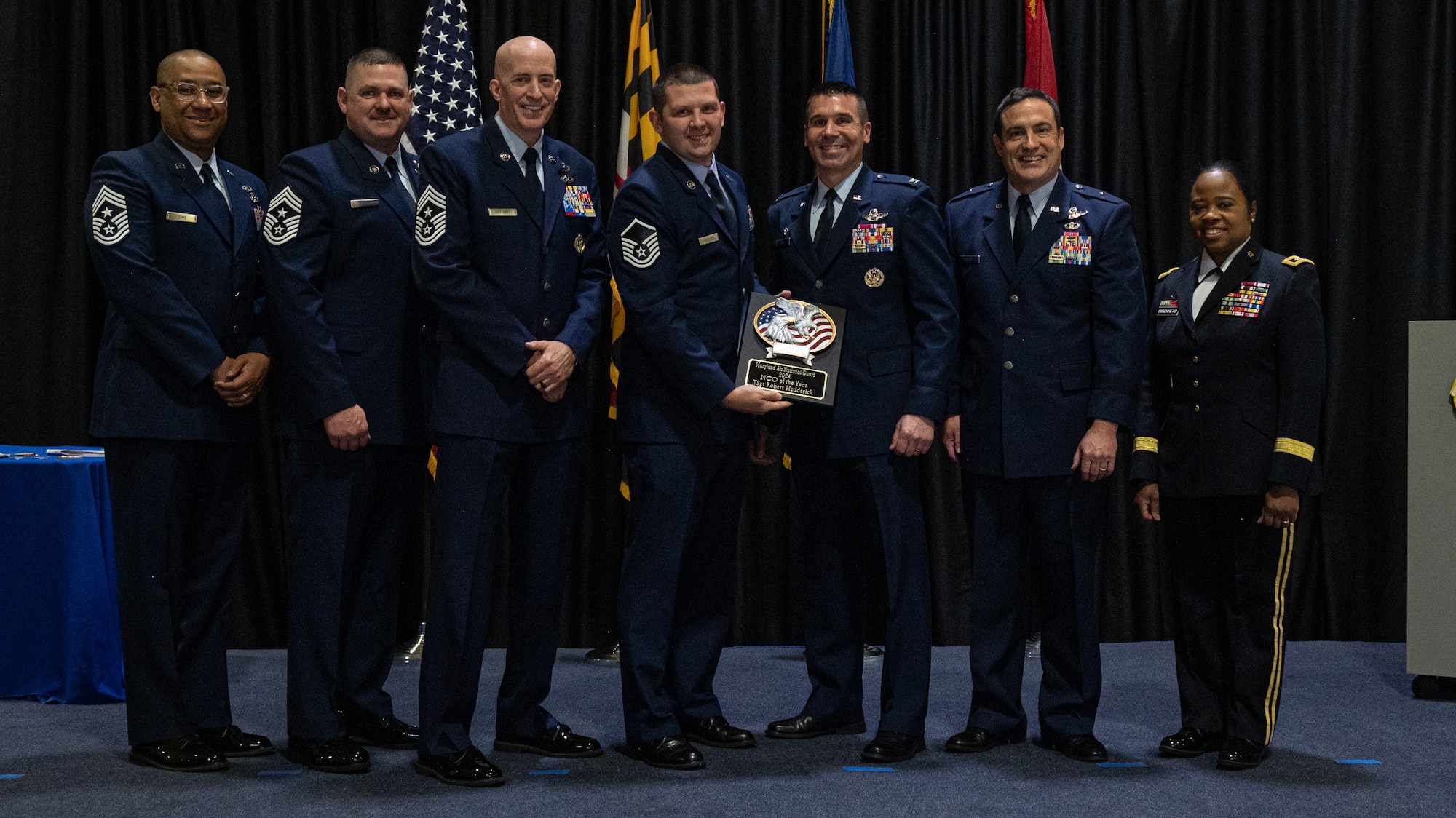 Maryland Air National Guard Master Sgt. Robert Hedderick, 175th Wing Outstanding Airman of the Year for the non-commissioned officer category, Maryland Air National Guard, receives a plaque at Martin State Air National Guard Base, Middle River, Maryland, Jan. 7, 2024.