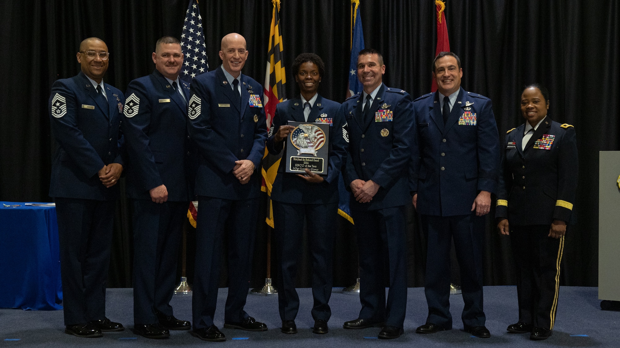 Maryland Air National Guard Master Sgt. Samillia Glover, 175th Wing Outstanding Airman of the Year for the senior non-commissioned officer category, Maryland Air National Guard, receives a plaque at Martin State Air National Guard Base, Middle River, Maryland, Jan. 7, 2024.