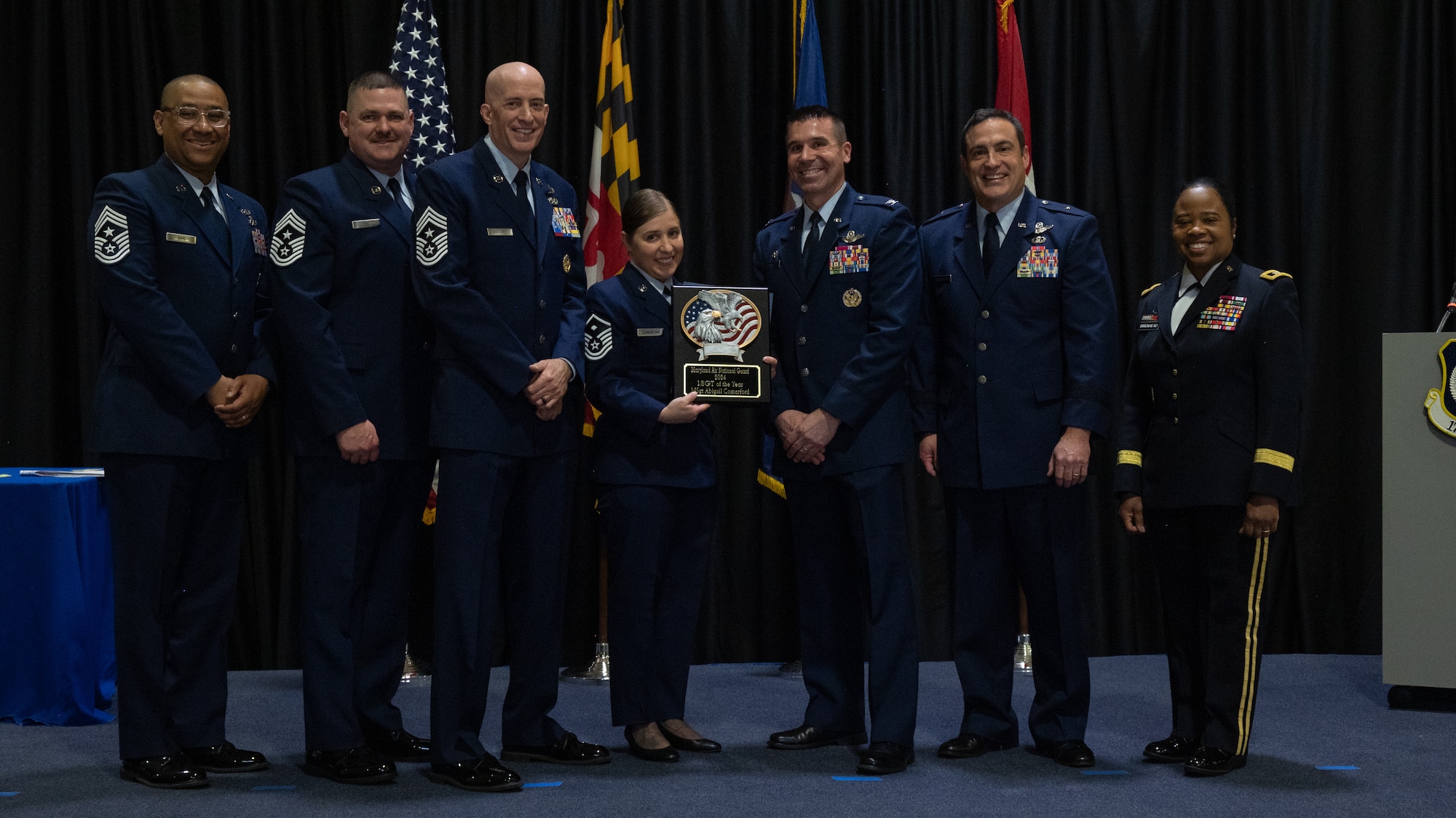 Maryland Air National Guard Master Sgt. Abigail Comerford, 175th Wing Outstanding Airman of the Year for the first sergeant category, Maryland Air National Guard, receives a plaque at Martin State Air National Guard Base, Middle River, Maryland, Jan. 7, 2024.