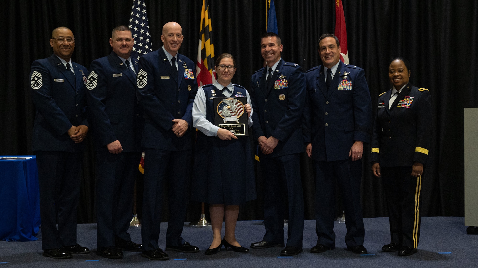 Maryland Air National Guard Capt. Allison Fleming, 175th Wing Outstanding Airman of the Year for the company grade officer category, Maryland Air National Guard, receives a plaque at Martin State Air National Guard Base, Middle River, Maryland, Jan. 7, 2024.