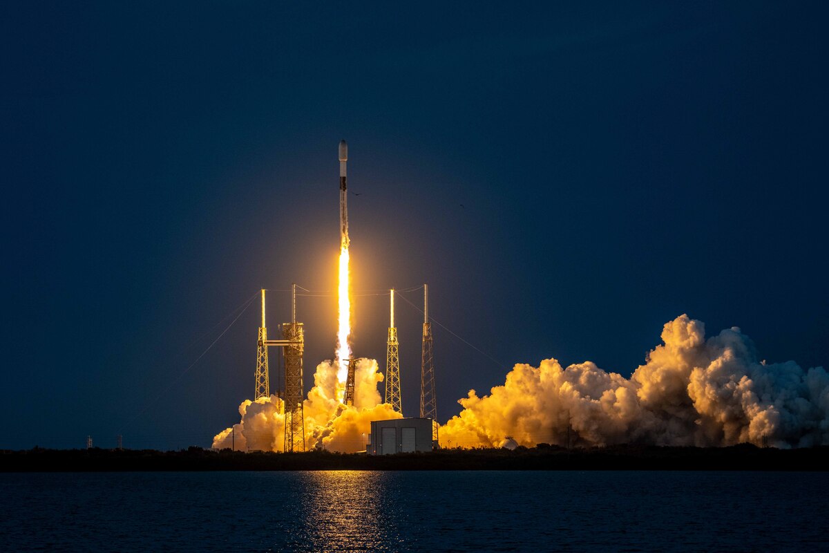 A rocket launches at night.