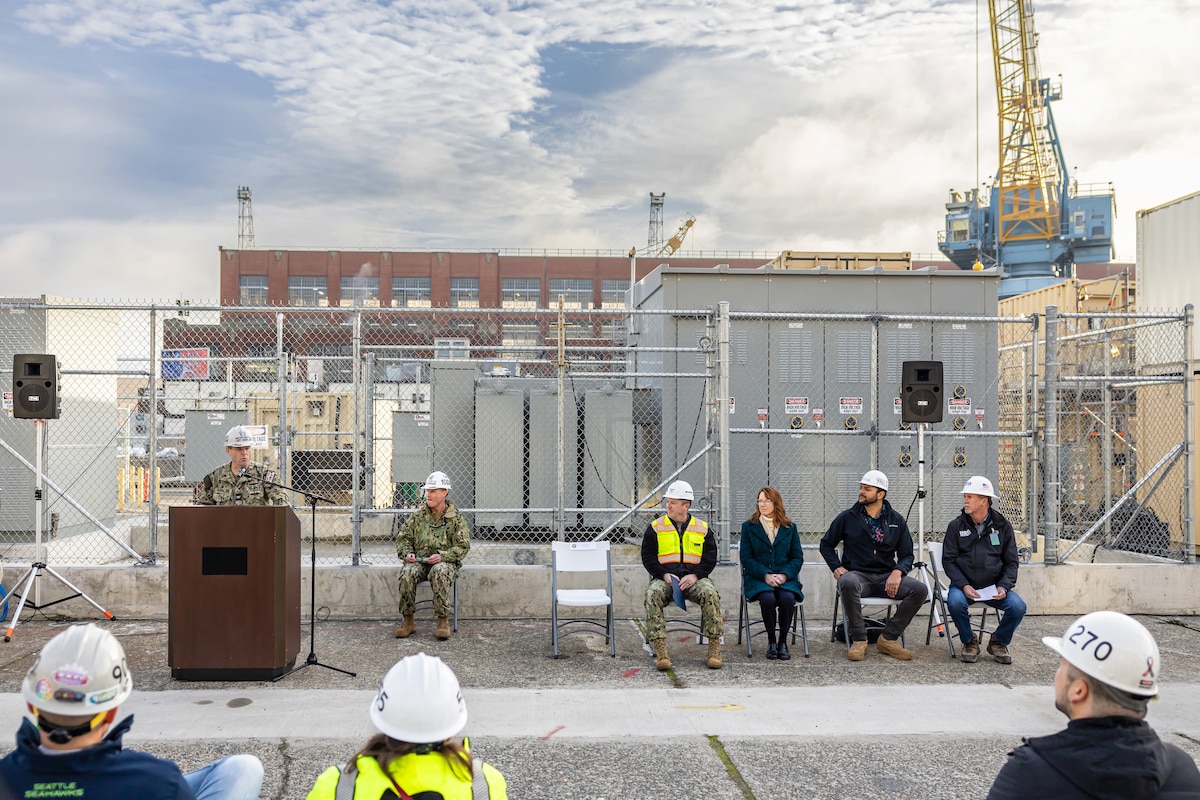 Capt. JD Crinklaw, commander, Puget Sound Naval Shipyard &
Intermediate Maintenance Facility, addresses audience members Nov. 20, 2023, during a ribbon-cutting ceremony for the new substation near Dry dock 4 at the shipyard in Bremerton, Washington. (U.S. Navy photo by Jeb Fach)