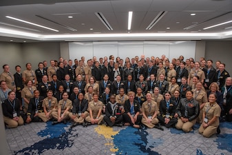 WASHINGTON (January 10, 2024) -- Chief of Naval Operations Adm. Lisa Franchetti poses for a group photo with guests during a Women in the Navy Networking Breakfast at the Surface Navy Association's 36th Annual National Symposium at the Hyatt Regency Crystal City in Washington D.C., Jan. 10. The symposium is a three-day conference that provides an opportunity for discussions on a broad range of professional and career issues for the surface Navy. (U.S. Navy photo by Chief Mass Communication Specialist Michael B Zingaro/released)