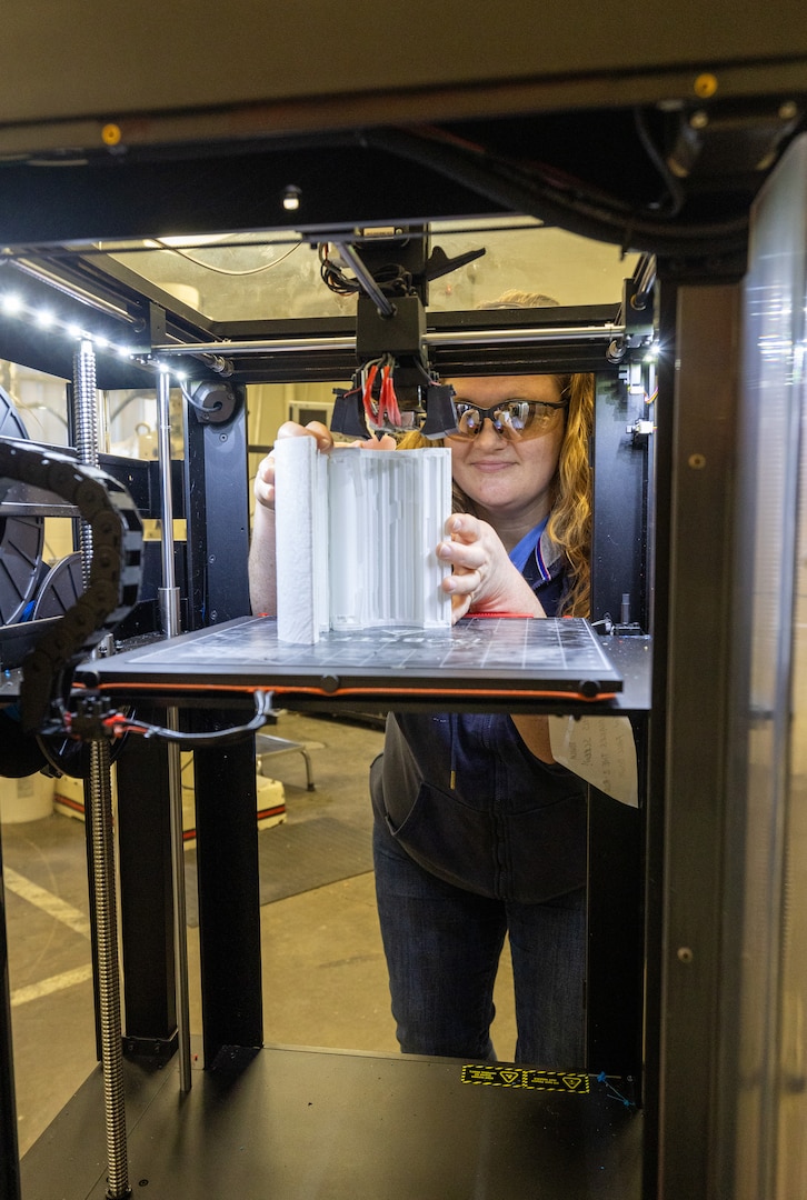 Moonshine Lab employee Kati Pero, toolmaker, Shop 31, Inside Machinist, has spent the past month collaborating with a Puget Sound Naval Shipyard & Intermediate Maintenance Facility customer on an innovative STEM 3D-printing project, at the command in Bremerton, Washington. (U.S Navy photo by Wendy Hallmark)