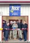 From left, Robert Bianchi, chief executive officer, Navy Exchange Service Command; Master Chief Michael C. Gosart, command senior enlisted leader, Puget Sound Naval Shipyard &
Intermediate Maintenance Facility; Capt. JD Crinklaw, commander, PSNS & IMF; Rear Adm. Scott M. Brown, deputy commander, Industrial Operations, Naval Sea Systems Command; and James Cook, deputy executive director, PSNS & IMF, cut the ribbon to officially open the new NEXCOM Micro Market inside Building 1246, at the command in Bremerton, Washington, Dec. 7, 2023. (U.S Navy Photo by Wendy Hallmark)
