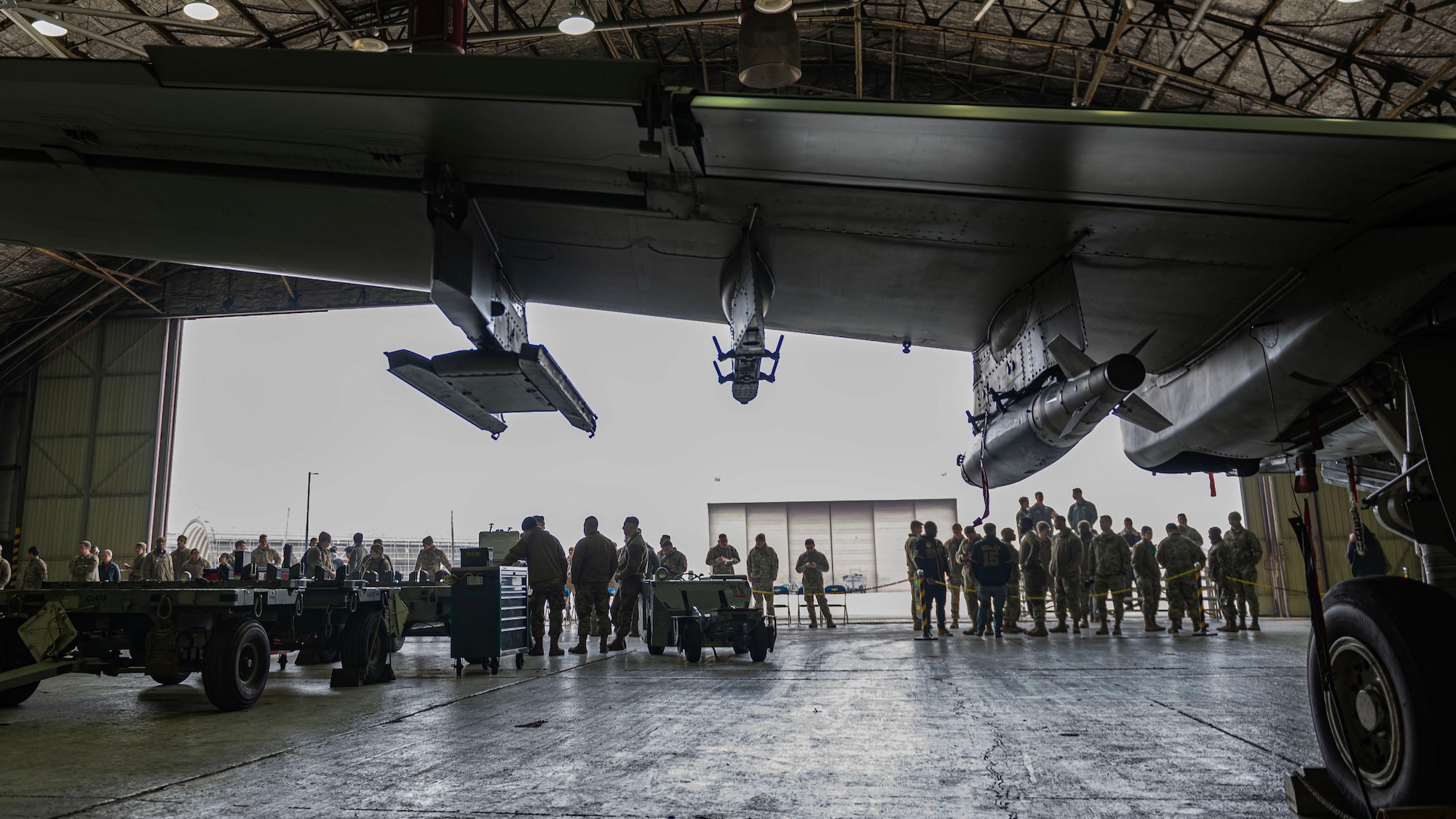 Members from the 25th Fighter Generation Squadron and 36th Fighter Generation Squadron compete side-by-side loading GBU-38 Joint Direct Attack Munition Bombs onto A-10C Thunderbolt II and F-16 Fighting Falcon aircrafts, respectively, for the right to be called best load crew for the fourth quarter at Osan Air Base, Republic of Korea, Jan. 5, 2024. As part of the competition, teams are evaluated on how quickly and efficiently they can inspect and load munitions onto their respective aircraft. (U.S. Air Force photo by Staff Sgt. Aubree Owens)