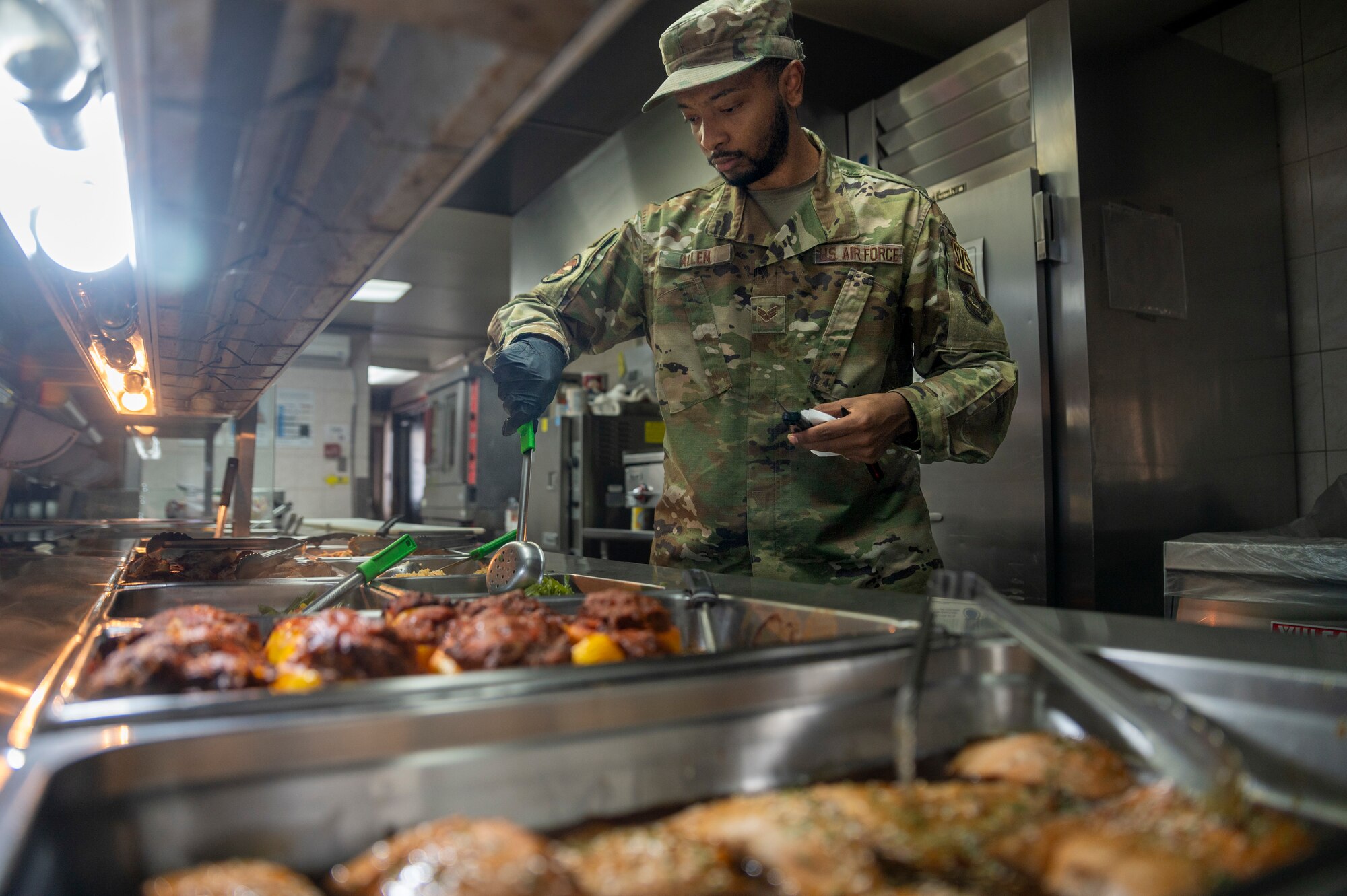 U.S. Air Force Senior Airman Trevor Allen, 51st Force Support Squadron food services journeyman, tests food temperature at Osan Air Base, Republic of Korea, Jan. 8, 2024. Temperature testing, conducted by the 51st FSS, is a crucial safety procedure to verify that all food is adequately cooked and complies with safety standards for Airmen. (U.S. Air Force photo by Senior Airman Trevor Gordnier)