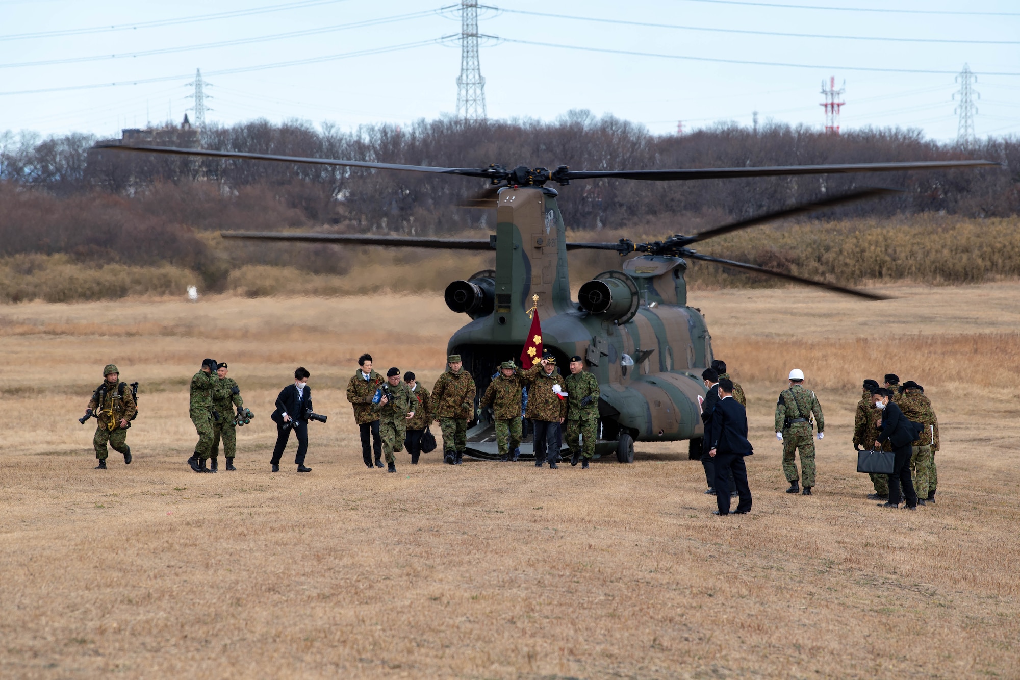 Japan Minister of Defense Minoru Kihara disembarks from a Japan Ground Self-Defense Force CH-47 Chinook to attend the annual New Year's Jump exhibition at Camp Narashino, Japan.