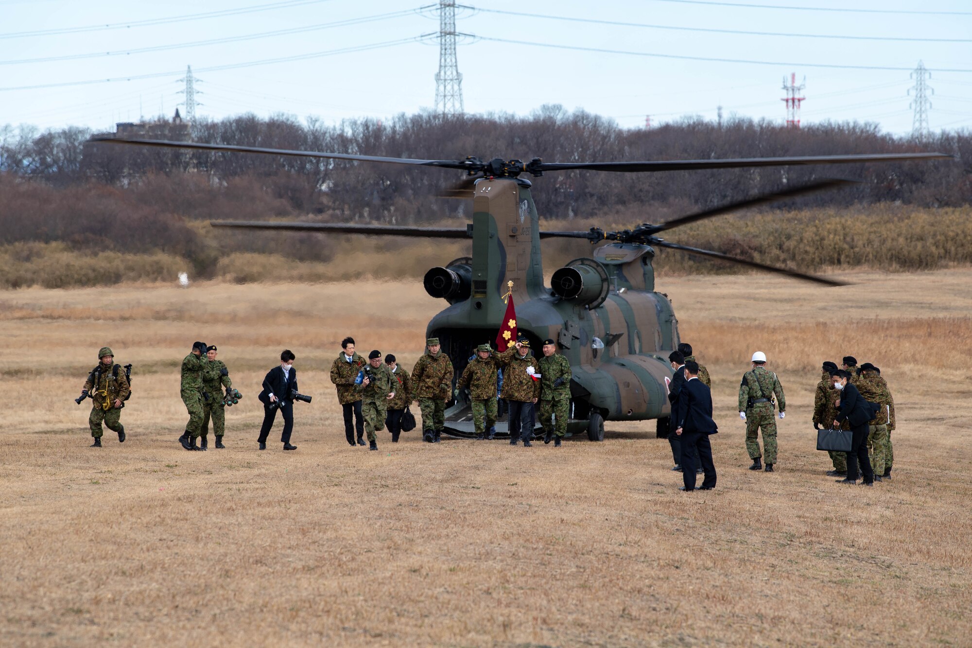 Japan Minister of Defense Minoru Kihara disembarks from a Japan Ground Self-Defense Force CH-47 Chinook to attend the annual New Year's Jump exhibition at Camp Narashino, Japan.