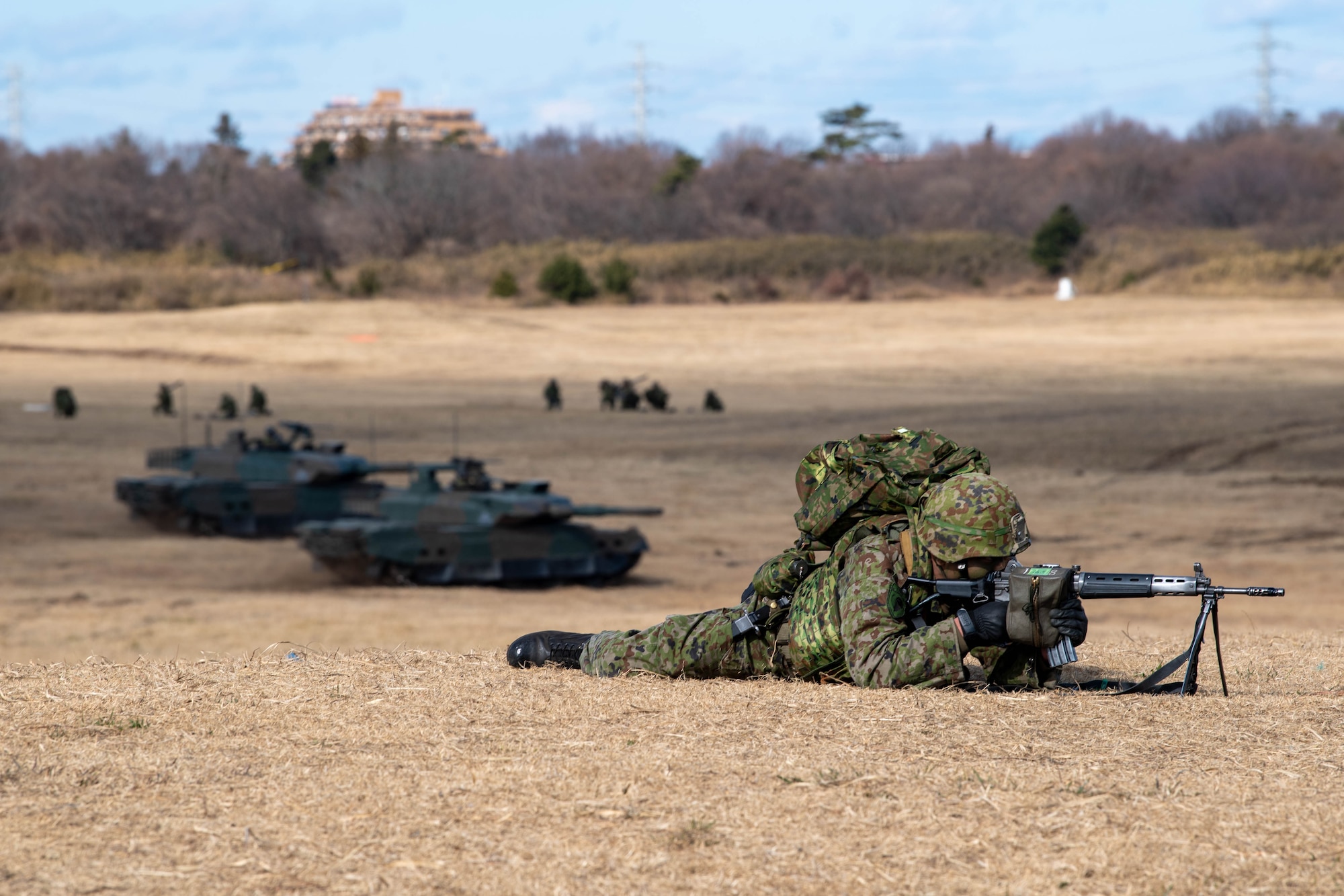A soldier from the Japan Ground Self-Defense Force 1st Airborne Brigade aims at his target during the annual New Year's Jump exhibition at Camp Narashino, Japan.