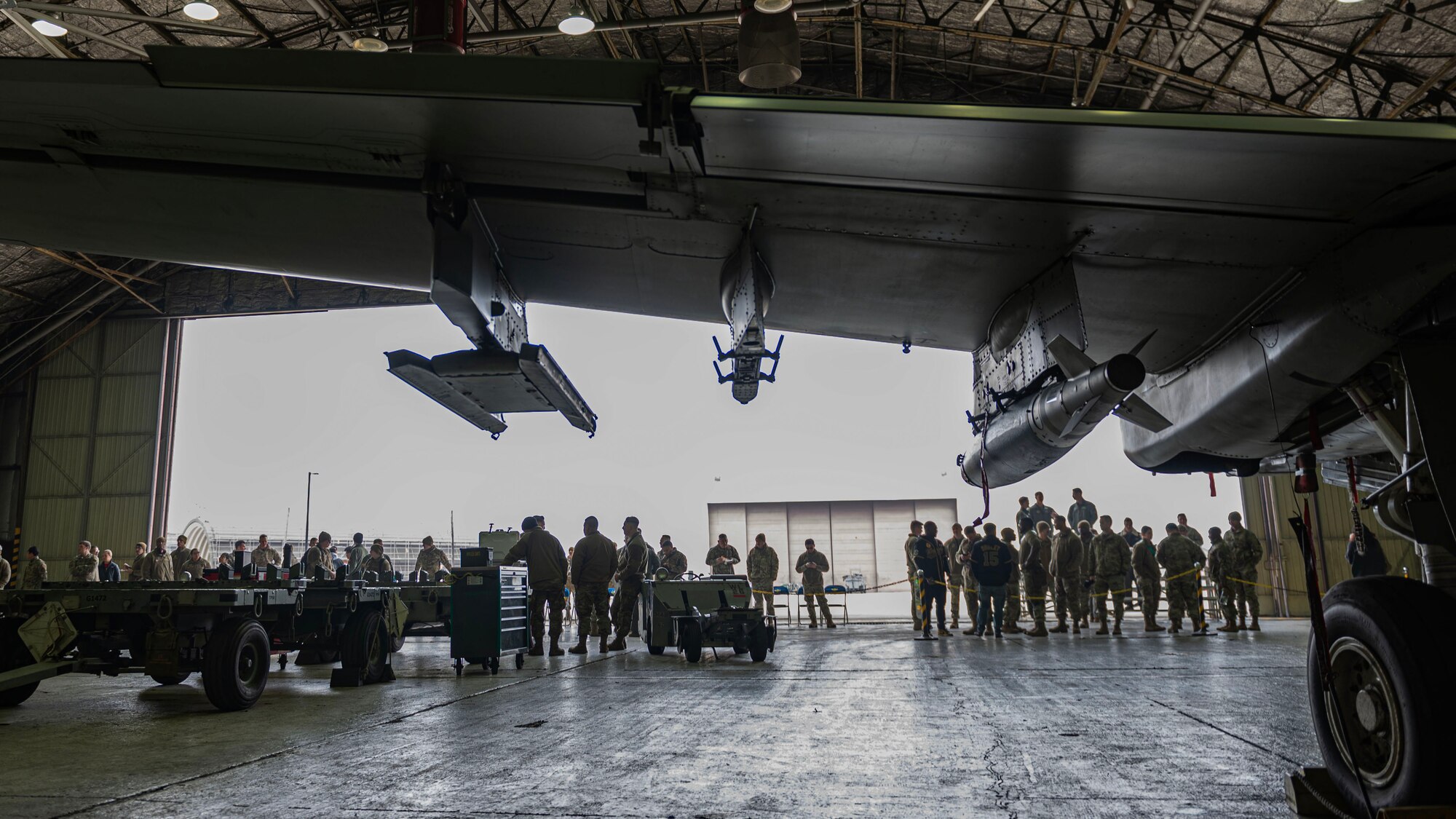 Members from the 25th Fighter Generation Squadron and 36th Fighter Generation Squadron compete side-by-side loading GBU-38 Joint Direct Attack Munition Bombs onto A-10C Thunderbolt II and F-16 Fighting Falcon aircrafts, respectively, for the right to be called best load crew for the fourth quarter at Osan Air Base, Republic of Korea, Jan. 5, 2024. As part of the competition, teams are evaluated on how quickly and efficiently they can inspect and load munitions onto their respective aircraft. (U.S. Air Force photo by Staff Sgt. Aubree Owens)