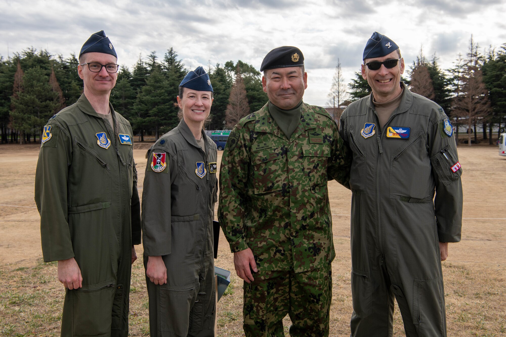 U.S. Air Force Lt. Col. Christopher Casler, 374th Operations Group deputy commander; U.S. Air Force Lt. Col. Kira Coffey, 36th Airlift Squadron commander; Japan Ground Self-Defense Force Maj. Gen. Junya Wakamatsu, 1st Airborne Brigade commander; and U.S. Air Force Col. Andrew Roddan, 374th Airlift Wing commander, pose for a photo following the annual New Year's Jump exhibition at Camp Narashino, Japan.
