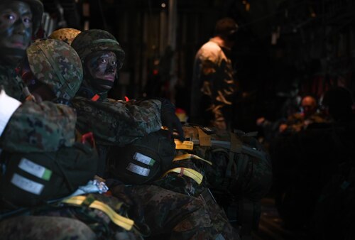 Photo of soldiers sitting.