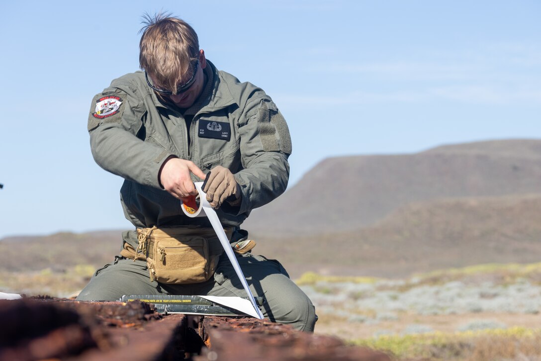 U.S. Marine Corps Sgt. Cameron Lott, an explosive ordinance disposal technician with Marine Wing Support Squadron (MWSS) 373, Marine Air Control Group 38, 3rd Marine Aircraft Wing, attaches C4 blocks to the Bailey Bridge during a bridge demolition operation as part of phase I of Strategic Mobility Exercise (STRATMOBEX) II at San Clemente Island, California, Jan. 5, 2024.  During phase I, MWSS-373 demolished a hazardous bridge that hindered range control’s ability to insert targets into the Shore Bombardment Area of San Clemente Island. Phase I set conditions for phases II and III of STRATMOBEX II, the construct of a shallow water crossing and follow on missions. (U.S. Marine Corps photo by Lance Cpl. Jennifer Sanchez)