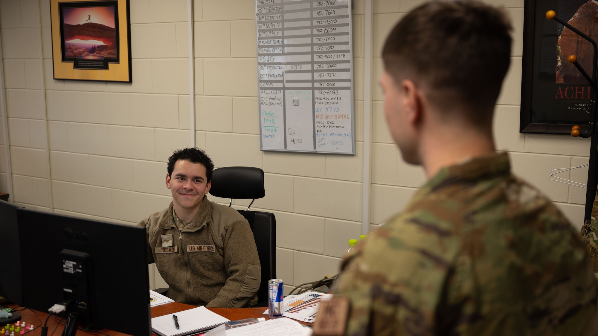 Staff Sgt. Peter Southworth, right, 8th Fighter Wing chapel, NCO in charge of chapel readiness, speaks with Airman Jose Rosado, 8th Maintenance Group, maintenance analyst, during his routine check-ins