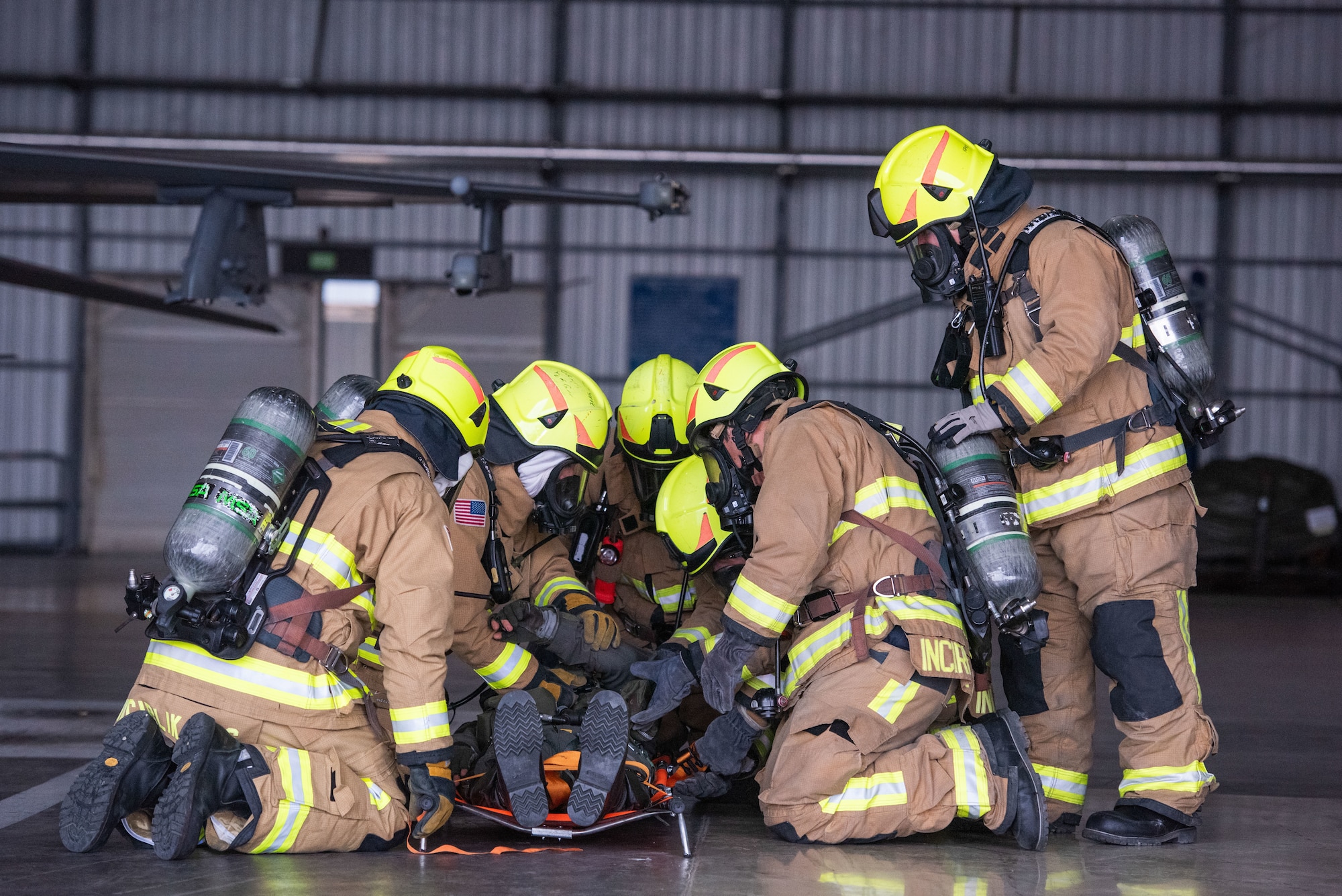 Firefighters assigned to the 39th Civil Engineer Squadron conduct a simulated unconscious pilot rescue operation during a crash, damaged, or disabled aircraft recovery (CDDAR) exercise at Incirlik Air Base, Türkiye, Jan. 8, 2024.