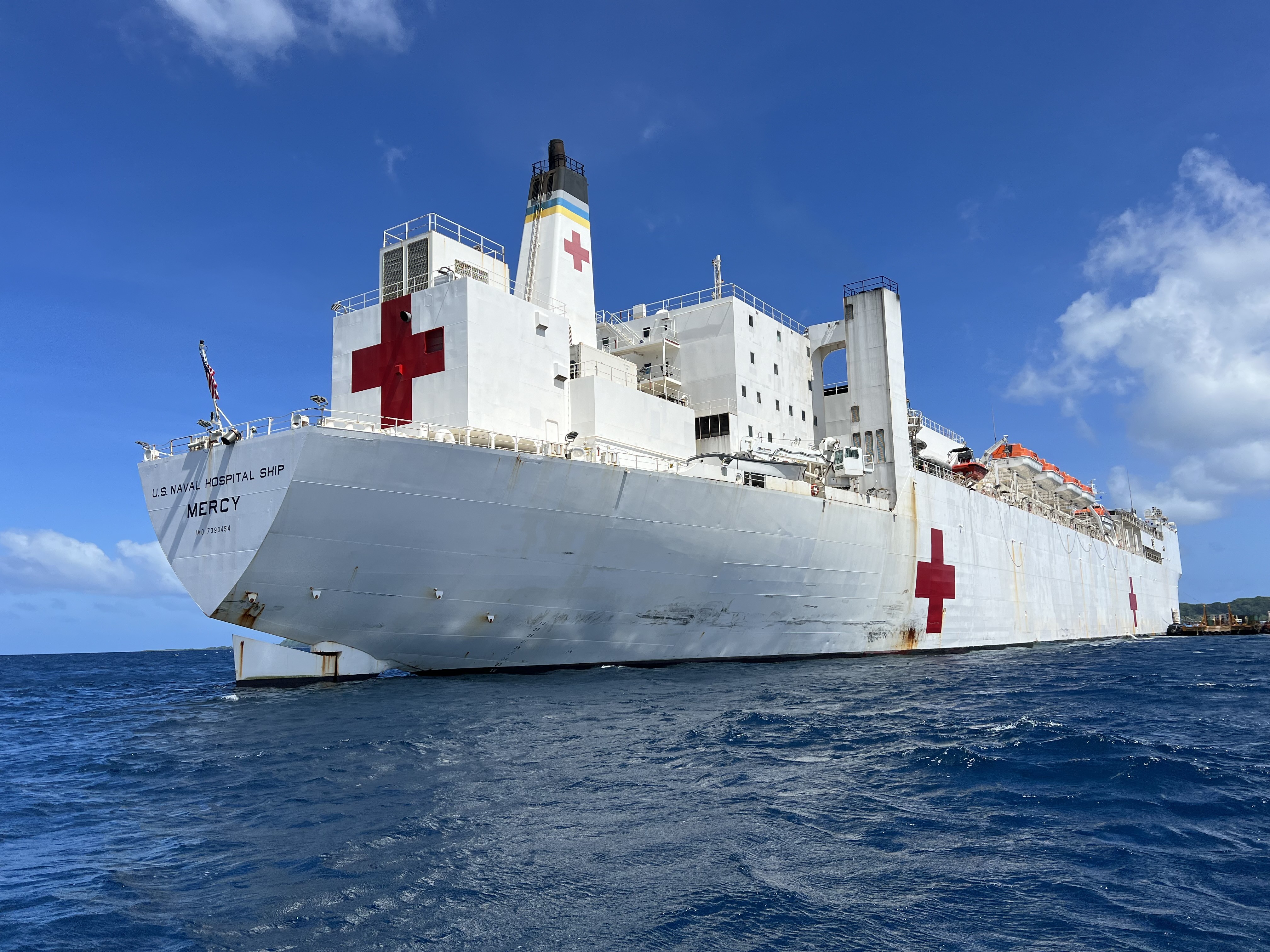 The hospital ship USNS Mercy (T-AH 19) anchors off of Chuuk, Federated States of Micronesia, as part of Pacific Partnership 2024-1, Jan. 10, 2024. Pacific Partnership, now in its 19th iteration, is the largest multinational humanitarian assistance and disaster relief preparedness mission conducted in the Indo-Pacific and works to enhance regional interoperability and disaster response capabilities, increase security stability in the region, and foster new and enduring friendships. (U.S. Navy photo by Ens. Lacy Burkett)