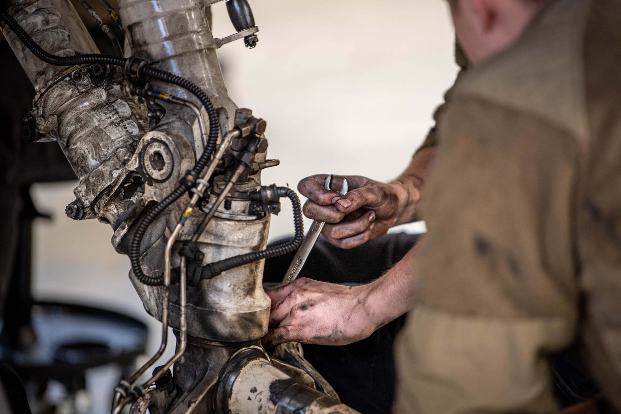 U.S. Air Force Airmen assigned to the 480th Fighter Generation Squadron Phase Section, conduct a periodic maintenance inspection on a 480th Fighter Squadron F-16 Fighting Falcon fighter jet at Spangdahlem Air Base, Germany, Nov. 30, 2023.