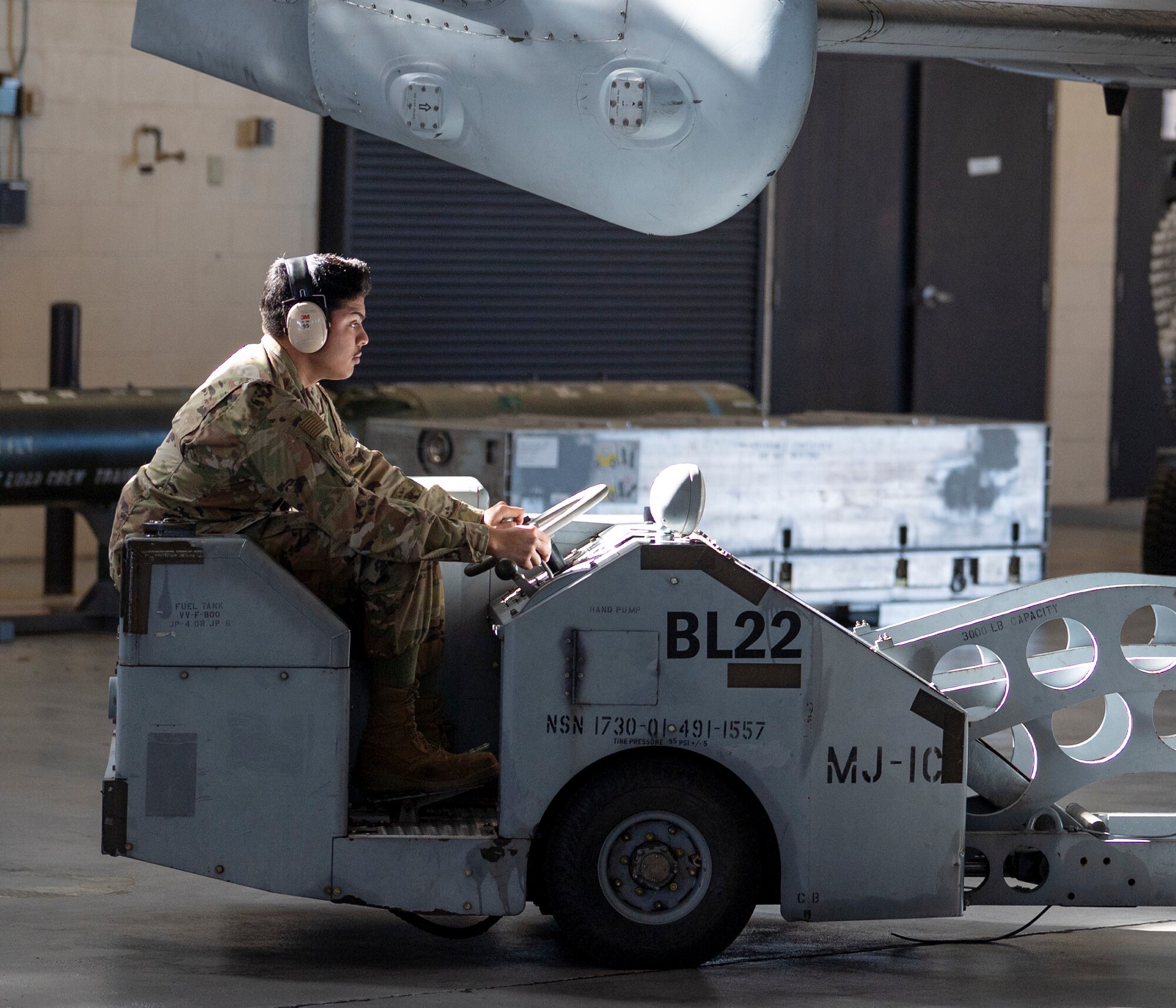 U.S. Air Force Airman 1st Class Nicholas Martinez, 75th Fighter Generation Squadron load crew member, drives an aeriel stores lift truck at Moody Air Force Base, Georgia, Jan 5, 2024. The ASLTs are used to safely and quickly transport and load munitions. (U.S. Air Force photo by Airman 1st Class Leonid Soubbotine)