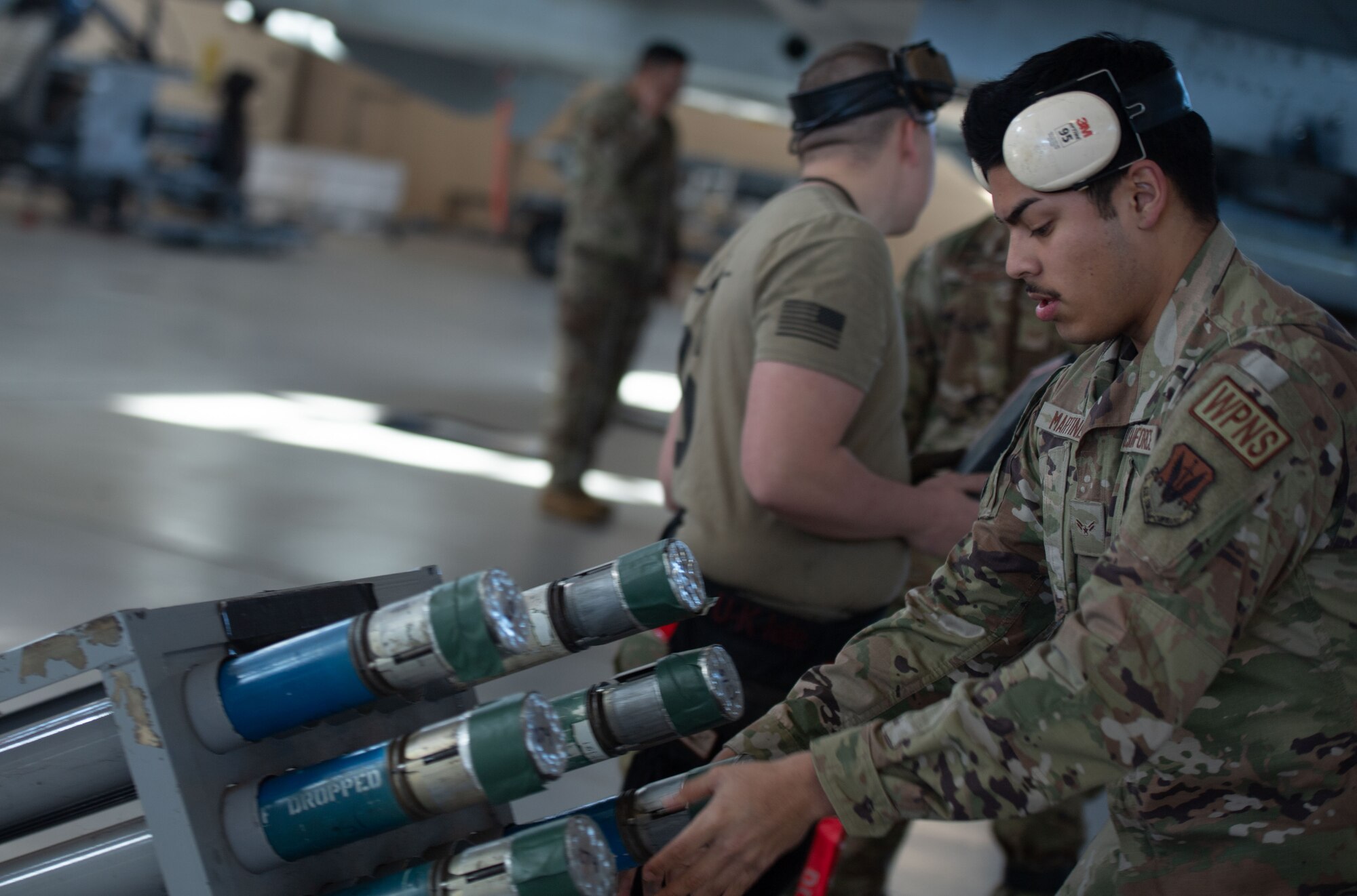 U.S. Air Force Airman 1st Class Nicholas Martinez, 75th Fighter Generation Squadron load crew member, prepares munitions to be loaded at Moody Air Force Base, Georgia, Jan 5, 2024. Martinez was the third man on the 75th FGS’s team competing in a quarterly load crew competition. (U.S. Air Force photo by Airman Cade Ellis)