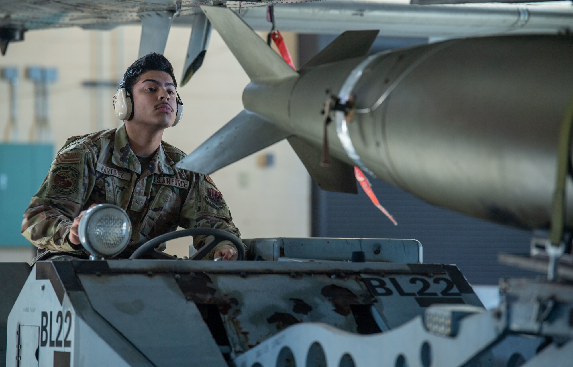 U.S. Air Force Airman 1st Class Nicholas Martinez, 75th Fighter Generation Squadron load crew member, helps load munitions onto an A-10C Thunderbolt II at Moody Air Force Base, Georgia, Jan 5, 2024. Weapons load competitions give the 75th and 74th FGS a chance to compete while practicing their weapons loading skills. (U.S. Air Force photo by Airman Cade Ellis)