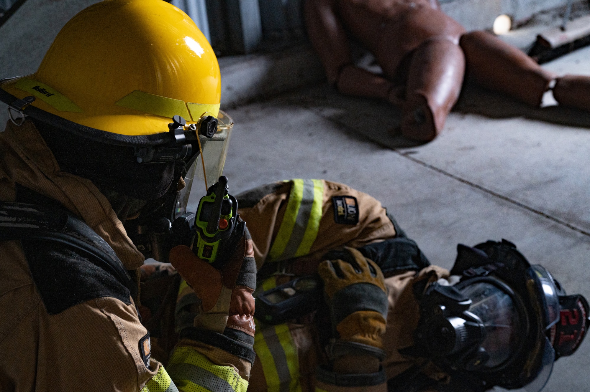 A firefighter from the 6th Civil Engineering Squadron simulates rescuing a downed firefighter as part of rapid intervention training at MacDill Force Base, Florida, Jan 11, 2024.