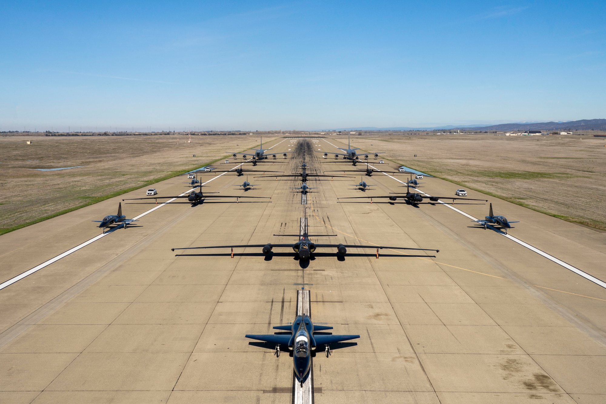 U.S. Air Force U-2 Dragon Lady’s and chase cars from the 99th Reconnaissance Squadron, T-38 Talon’s from the 1st Reconnaissance Squadron, and KC-135R Stratotanker’s from the 940th Air Refueling Wing conduct an elephant walk on Beale Air Force Base, California, Jan. 4, 2023.