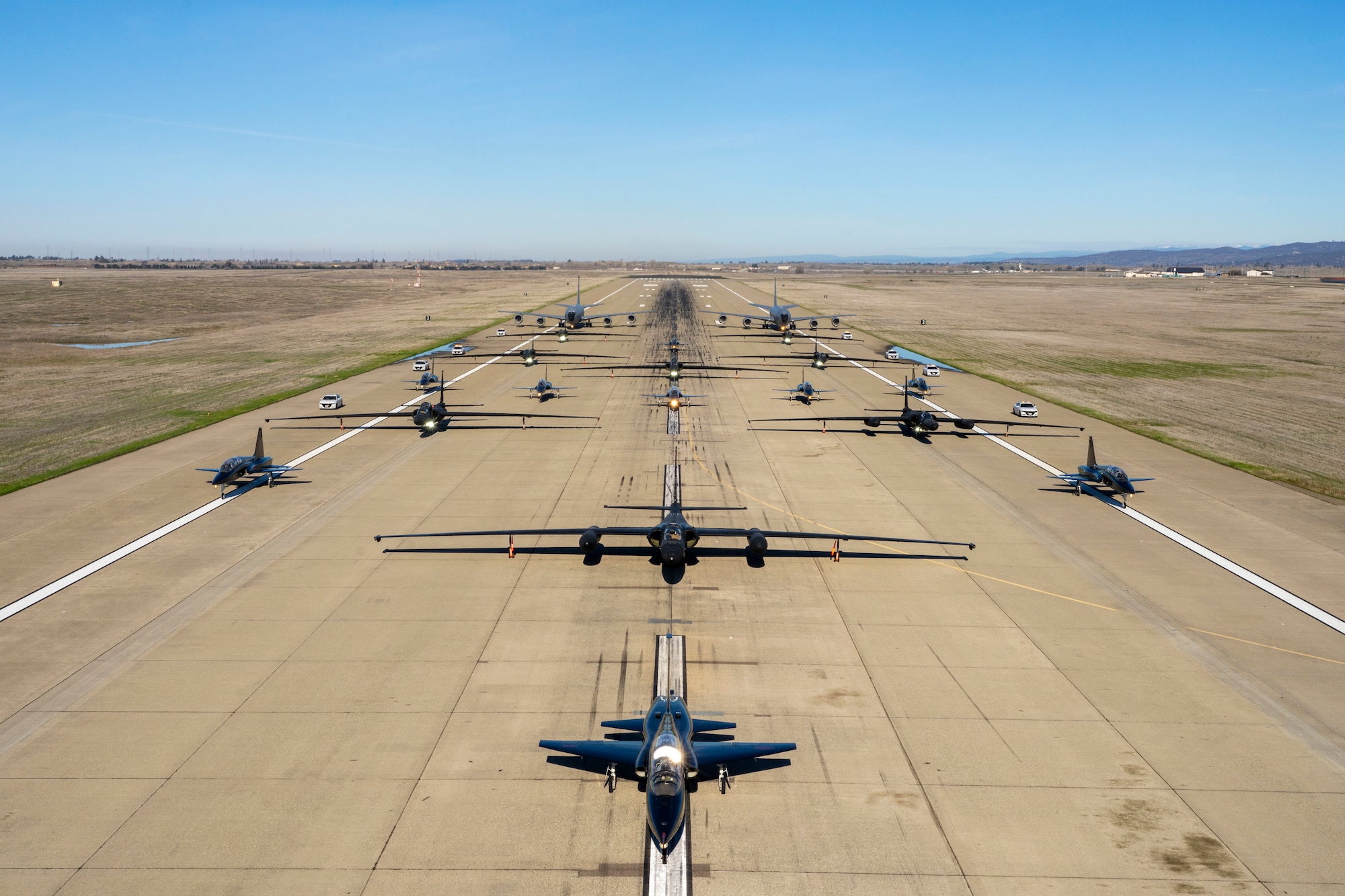 U.S. Air Force U-2 Dragon Lady’s and chase cars from the 99th Reconnaissance Squadron, T-38 Talon’s from the 1st Reconnaissance Squadron, and KC-135R Stratotanker’s from the 940th Air Refueling Wing conduct an elephant walk on Beale Air Force Base, California, Jan. 4, 2023.